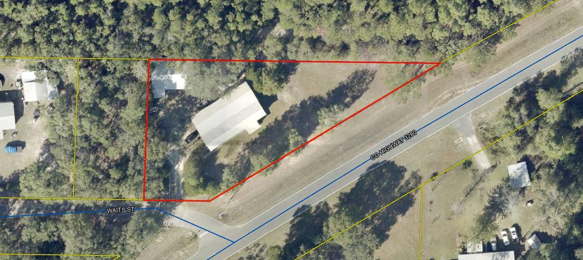 Check out this manufactured home on nearly 3/ of an acre. The home is covered by a pole barn. Previous owner added on front and back enclosed porches. Off the back porch is an expansive wood working shop.