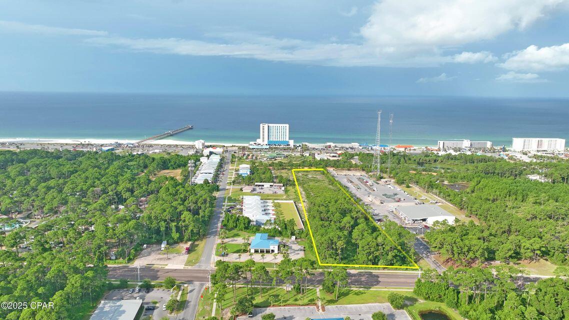 Prime 2.7-Acre Commercial Parcel on Hutchinson Beach Road. Unlock the potential of one of the most sought-after commercial locations in Panama City Beach. This 2.7-acre parcel sits directly on Hutchinson Beach Road (Middle Beach Road), offering high visibility and excellent access with frontage on one of the area's busiest corridors. Strategically positioned just minutes from top attractions including Pier Park, Top Golf, and Dolly Parton's Stampede Dinner Theater, this location benefits from heavy year-round traffic and close proximity to the beach, shopping, dining, and entertainment. Zoned for commercial use, this site is ideal for a hotel, restaurant, retail center, or other high-demand development. With utilities available and zoning in place, this is a rare opportunity for developers and investors to secure a premier site in a booming coastal market.