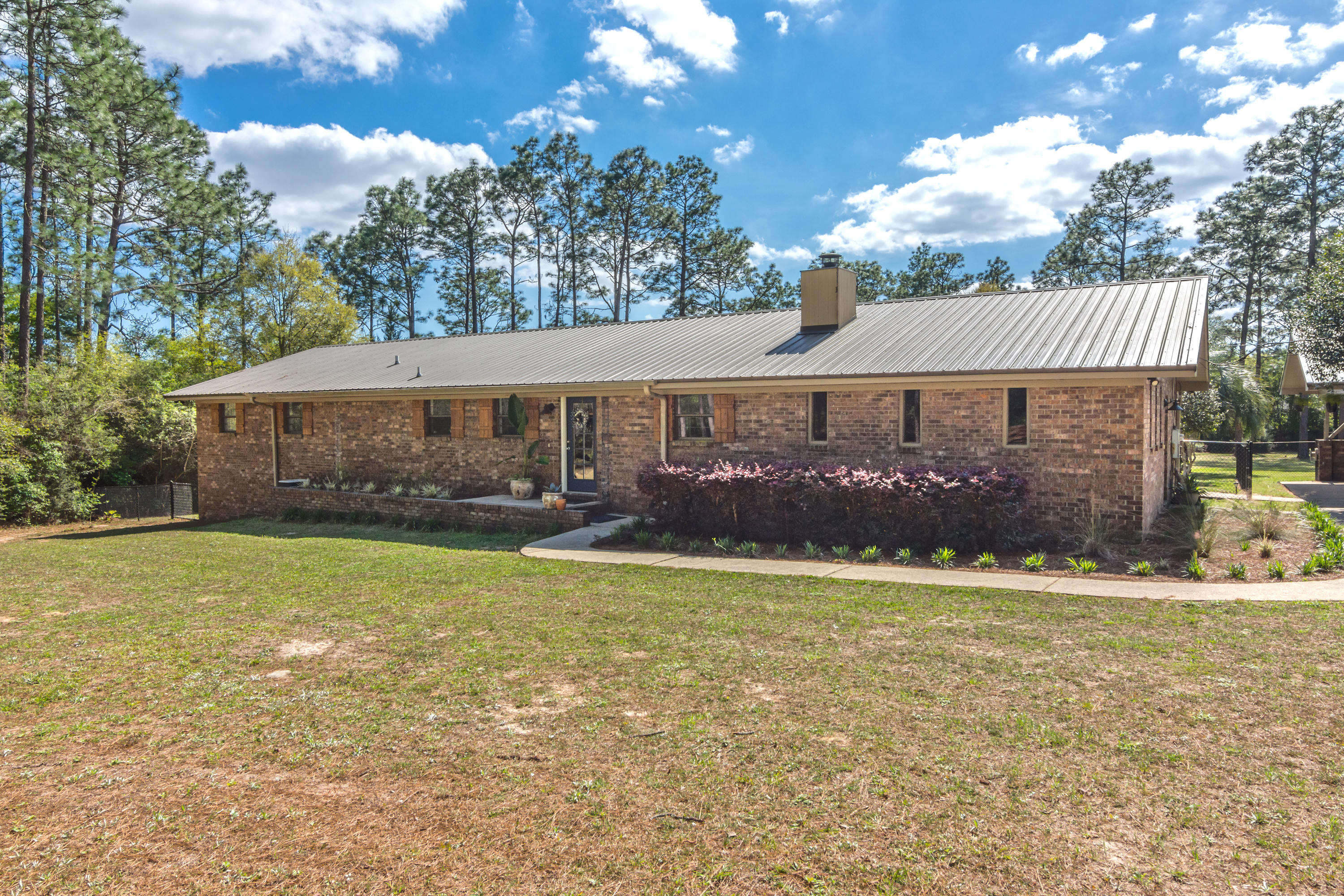 **Back on the Market - thru no fault ofseller** Don't let this beautiful brick home located in the popular Ridge Lake area pass you by! This pristine 5-bedroom/ 2-bathroom renovated home is nestled on 2.3 acres and is within a few-minutes' drive to Crestview High School, Middle and Elementary Schools, as well as, North Crestview shopping. Here are just a few of its wonderful features this 2573 sq ft home offers: metal roof; cozy wood-burning fireplace, granite counter tops in kitchen and bathrooms; spacious open floor plan; luxury hard-wood flooring; stainless-steel kitchen appliances; breakfast bar; covered back patio and a large 2-car carport under roof with overhead storage. New Electric Water heater will be installed before closing.