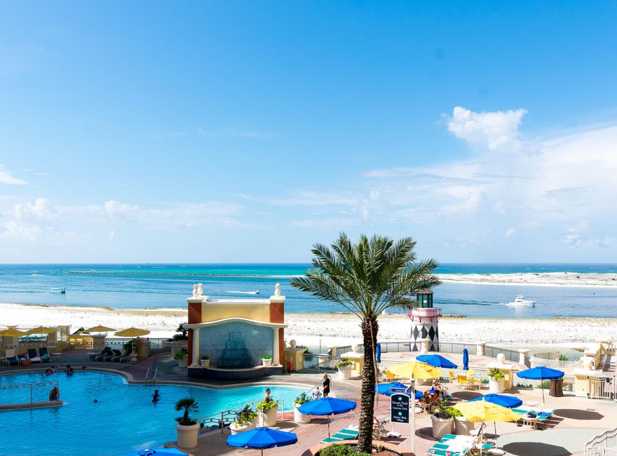 This 2 bedroom (plus a bunk room!), 2 bathroom condo boasts stunning views overlooking the Destin Harbor, Gulf of Mexico and the pool below. If you're looking for an income generating vacation rental, this is the one - owner has averaged over $82,000 gross rental income per year!! Living and dining room furnishings are all brand new and of great quality. Brand new wood look flooring just installed in living room and bedrooms in February 2021 - increasing the rental potential going forward! All future rentals will convey to buyer. Emerald Grande is situated on the Destin Harbor, overlooking Harborwalk Village below. Plenty of great shopping, dining, fishing, water sports and entertainment in walking distance.