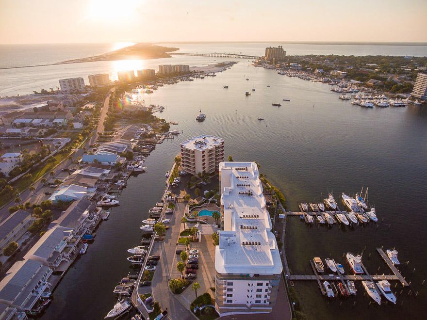 This 4th floor end unit at Harbor Lights is incredible. This is an exquisite luxury condominium. Find two guest suites, & a living area in the south wing of the unit, all connect to an expansive balcony with views of a harbor channel. Head north into the unit to find the spacious kitchen, complete with stainless steel appliances, granite countertops, a pantry, & plentiful storage. A large living room leads to a spacious balcony that overlooks Destin Harbor & Marina. Off of the living area is the master bedroom complete with walk in closet. Attached find the master bath with a double sink, garden tub, & stand up shower. Laundry room connects here & exits to the foyer. Storage unit conveys. Garage #1 can be purchased for an additional $30,000. Paradise you've got to see for yourself!