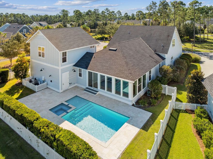 Welcome to 169 Sandchase Circle, an exceptional 5-bedroom, 4-bath home offering 3,732 square feet of thoughtfully designed living space in the highly sought-after PATHWAYS Phase of Watersound Origins. Perfectly positioned on a quiet CORNER lot across from a beautifully landscaped community park, this home enjoys serene views of the homeowners' pool, neighborhood pond, and Preserve beyond--creating a tranquil coastal setting.From the moment you arrive, the welcoming front porch invites you to relax and take in the sunset views across the green park framed by tall pines. Step inside to a bright and open interior enhanced by upgraded shiplap detailing and an abundance of built-in STORAGE throughout--ideal for the buyer who values organization and space.
The primary suite is conveniently located on the first floor and features wood blinds with pull-down blackout shades, an en suite bath with dual vanities, abundant built-in cabinetry and drawers, and an expansive walk-in closet with wood shelving and cubbieslarger than most homes in Origins. A second bedroom on the main level offers its own walk-in closet and a pocket door to a full hall bath, perfect for guests or multi-generational living.
The chef's kitchen shines with quartz countertops, Bosch stainless appliances (gas available if preferred), a Sharp microwave drawer, a built-in coffee bar, and 2 walk-up pantries. The adjacent dining area is tucked just enough to feel distinct while maintaining the home's open flow to the spacious living room featuring a dry bar for entertaining.
A highlight of the home is the newly enclosed, fully insulated, heated, and cooled porchwith floor-to-ceiling windows (one operable) and sliders leading to the serene backyard.
Upstairs, a front loft provides a flexible space ideal for a sitting area, playroom, or home office, complemented by two bedrooms, a full bath, and custom wall shelving. A standout feature is the private 5th BEDROOM SUITE,a 600-square-foot addition above the garage with its own living area and custom built-ins, ideal for guests, teens, or an in-law suite.
The outdoor living is exceptional with an oversized heated saltwater pool and spa, surrounded by pavers, lounge space, and a stubbed gas line for a future grill or summer kitchen. The fenced yard includes grass space for pets or play.
Additional features include:
* Three HVAC units
* Medallion wood flooring
* Coastal Protection Security System with full exterior cameras
* Laundry room with sink, cabinetry, and washer/dryer included
* Epoxy-coated garage floor and extra-wide 2-car garage with storage closet and golf cart space
* Extra-long driveway accommodating up to four vehicles
This home is VACANT, ready for immediate move-in and PRICED TO SELL, offering an unbeatable combination of location, functionality, and coastal charm in one of the most desirable neighborhoods along 30A. $7K Painting Allowance for interior (pictures depict new color)