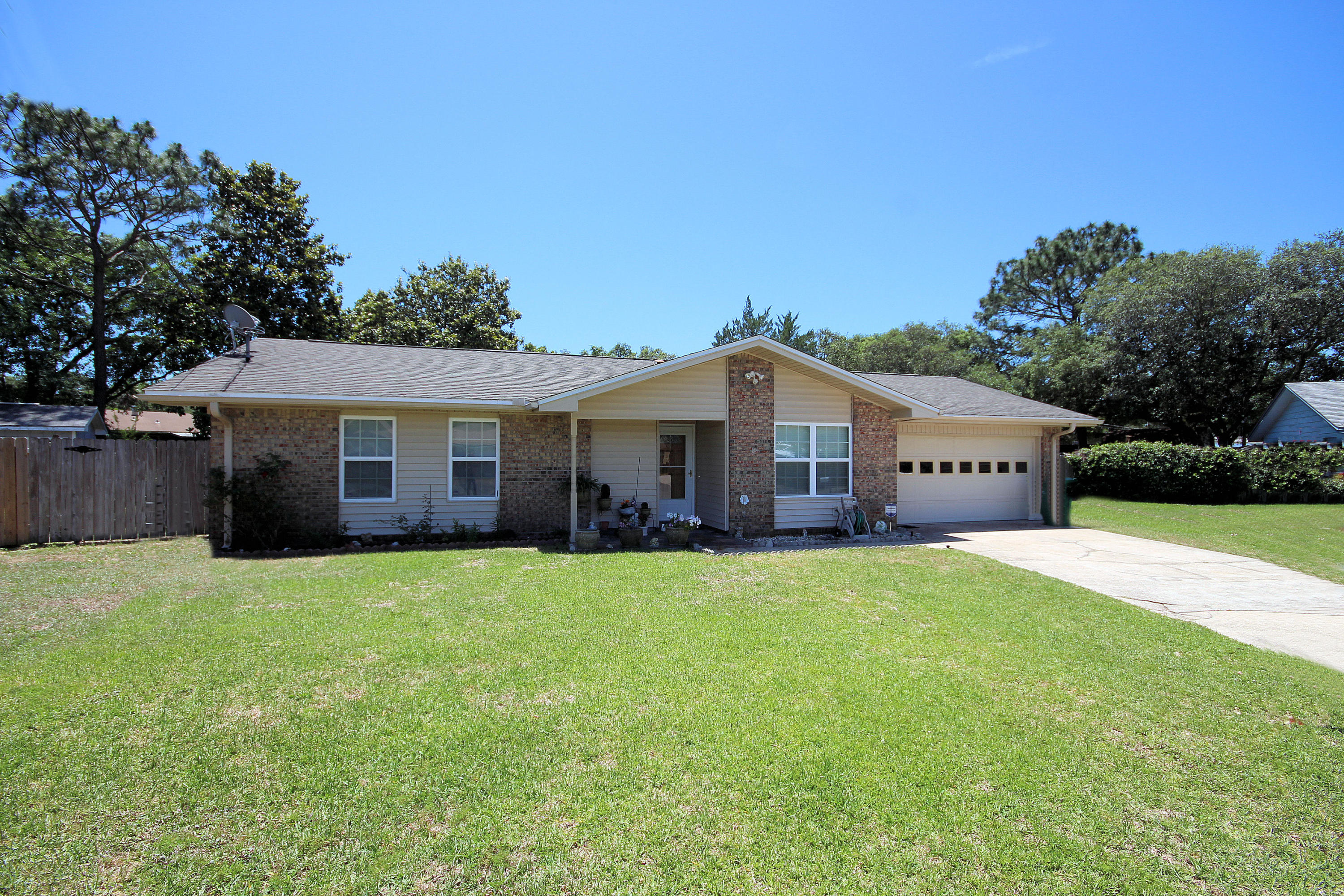 Beautifully maintained home in a convenient location between Eglin Air Force Base and Hurlburt Field Air Force Base, close to schools and shopping.Pride of Ownership shows from the minute you drive up to this home on a quiet cul-de-sac. Renovations in 2008 include tile floors, new front door, baths and skylights. All new hurricane proof windows in 2009, double insulation for energy efficiency and brand new Hot Water Heater. The kitchen exhaust is ventilated outside. All new ceiling in garage. Also a pull down stairs in garage. Outside there are orange, lemon, grapefruit and tangerine trees in the back yard and an 8x10 yard building . The fence in front is double gated so you could store a boat or RV in the back yard.
