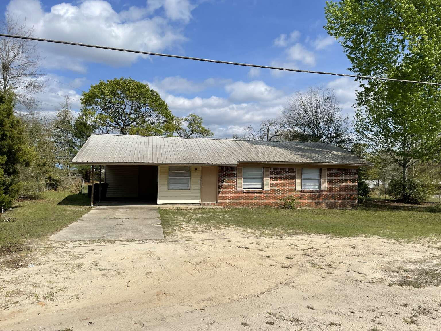 Welcome home to this charming 3-bedroom, 2-bathroom residence located in DeFuniak Springs. Boasting a fenced backyard and a convenient 1-car carport, this property offers both security and comfort. Inside, an inviting open layout awaits, seamlessly integrating the kitchen, dining area, and living room, perfect for gatherings and relaxation. A separate laundry room adds practicality to daily routines. Outside, enjoy the spaciousness of the large fenced backyard, offering ample space for outdoor activities and leisure. Don't miss the opportunity to make this your ideal haven.