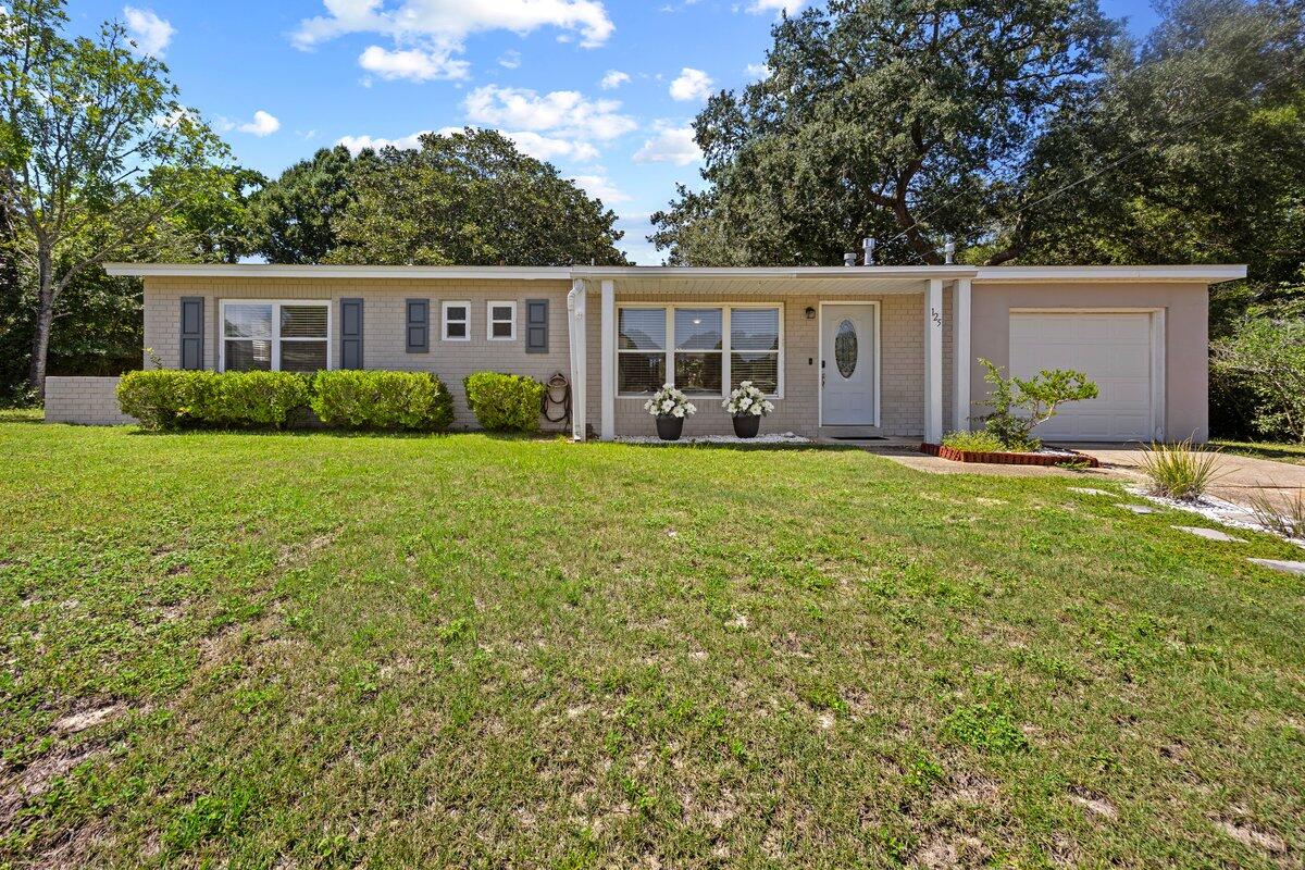 Come see this turnkey, investment-opportunity with a proven AirBnB history and no HOA! This renovated, 3BR/1.5 Jack and Jill bath cottage has fine finishes, updated flooring, appliances, bathrooms, tile, kitchen and a 2021 roof and 2024 water heater! Features include a serene, screened-in porch with a large, private, fenced backyard awaiting you, your family and or renters and guests to enjoy grilling and other yard activities. Regardless of your plans for this fine home, opportunities abound! With plenty of parking and closet space, including an owner's closet, this adorable home also has a primary suite with private bath access. Conveniently located just minutes away from Hurlburt Field, shopping, and beaches, perfect for rentals, first-time home buyers and those wanting to downsize!
