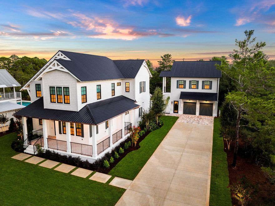 Step into coastal luxury at 47 Grande Ave, a newly constructed masterpiece by Cogent Building Group, perfectly situated on the west end of 30A. Boasting  4 bedrooms, a carriage house and impeccable design, this home offers an effortless blend of modern comfort and classic beach living.The first floor greets you with an expansive living room that flows seamlessly into a gourmet kitchen, designed with both elegance and functionality. Perfect for entertaining, the space features custom cabinetry, high-end appliances, and a central island that invites casual conversation. The first floor also hosts a guest bedroom, providing privacy and convenience for visiting family and friends. Ascend to the second floor, where you'll find two guest bedrooms and the lavish primary suite. The primary retreat features a spa-like ensuite bathroom and an oversized walk-in closet equipped with built-in laundry and a steamera detail that elevates everyday living to extraordinary.

The exterior is designed for relaxation and entertainment, with a private pool and hot tub offering the perfect setting to unwind under the Florida sun. Beyond the main house, a fully equipped carriage house adds flexibility to this remarkable property, complete with an additional guest bedroom, kitchen, living area, and a garage belowideal for hosting guests or generating rental income.

This home invites you to experience the best of coastal living, with refined details and a setting that embraces both comfort and style.