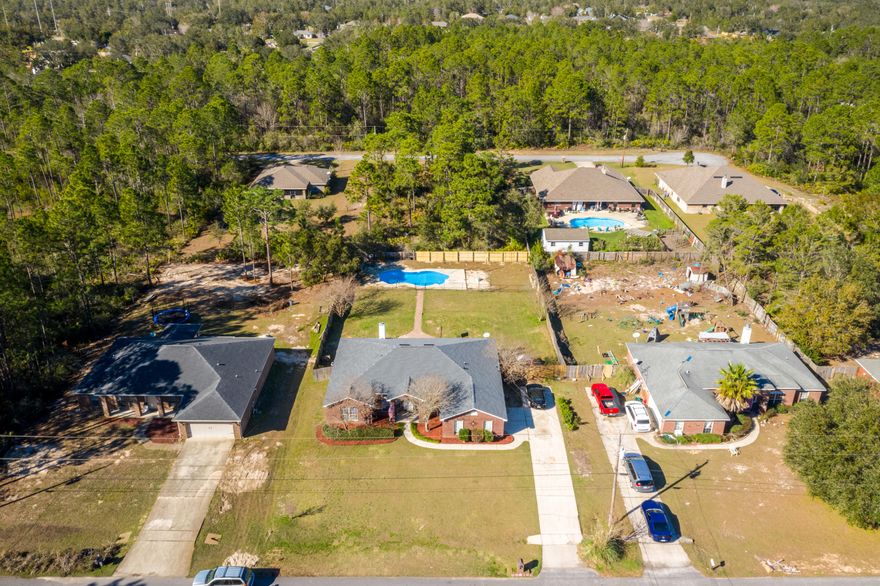 Home Sweet Home, is here.  Don't worry about roof replacement because it's been done.  This home has a split floor plan with a wood burning fireplace and an inground pool.  There is no carpet in this home; just tile and waterproof vinyl planks.With spring around the corner, this home will be great for entertaining.  Enjoy grilling on the pavered patio and sunshine in the spacious back yard.   Take a walk down the pavered path to the fenced in pool for some splash and tanning. No elbow bumping in this spacious kitchen.  Lots of countertop space and an island great for buffet style entertaining.  The range has a double oven.  The master bath has 2 walk-in closets, separate shower and jetted tub.  What a way to relax with candles and a drink!This is a must see home!