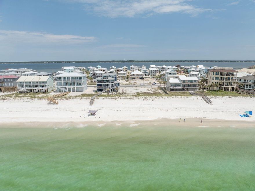 Imagine waking up each morning to the breathtaking views of the Gulf of Mexico and the serene bay, right from your doorstep. This unique opportunity allows you to build your dream home directly on the pristine sands of Navarre Beach, often called ''Florida's Best Kept Secret.'' Lot 6 boasts 95 feet of gulf frontage and a depth of approximately 133 feet, totaling more than one quarter of an acre of prime beachfront property. Nestled in a peaceful and private residential neighborhood, this gulf-front lot offers the perfect blend of tranquility and opportunity. With no HOA fees, you'll enjoy the freedom to create a custom home tailored to your desires, whether it be a full-time residence or a lucrative vacation rental. The location is a water enthusiast's paradise, offering a private-style.... beach with emerald green waters and easy access to the bay, ideal for boating and water sports. The famous Navarre Pier, the longest in Florida, is just a short walk or bike ride away, providing excellent fishing opportunities, stunning sunsets and an outdoor restaurant for dining with a view. Nature lovers will appreciate the proximity to the Santa Rosa area of the Gulf Islands National Seashore and the nearby state park, perfect for hiking, bird watching, exploring historic forts and camping. The lot is ready for development, with all required zoning, environmental tests, and permits from the county and the Department of Environmental Protection (DEP) completed by the sellers. The only step remaining is the approval of architectural/building permits, with existing building plans for a single-family dwelling available for interested buyers. Seize this rare chance to own a piece of paradise on Navarre Beach, where you can enjoy the best of Florida living.
