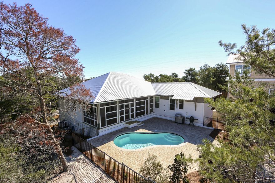 Brand new construction, a remarkable collaborative effort between architect and builder on a huge lot (65' x 140'); walking distance to the beach in Blue Mountain Beach. Tyler Doin, a renowned local architect, designed this original, 100% custom home with the finest quality materials and upgraded finishes. Wes Limbach, a reputable and meticulous builder, teamed up with Tyler to create this 30A Design & Development Concept Home.The great room features sloping ceilings. The kitchen has a large island and pantry, stainless steel back splashes and all state-of-the art Samsung stainless steel appliances. All the countertops and island are made of Black Leather Granite. The dining room and foyer feature an accent birch wall. The powder room has a dropped metal ceiling that mimics gaz