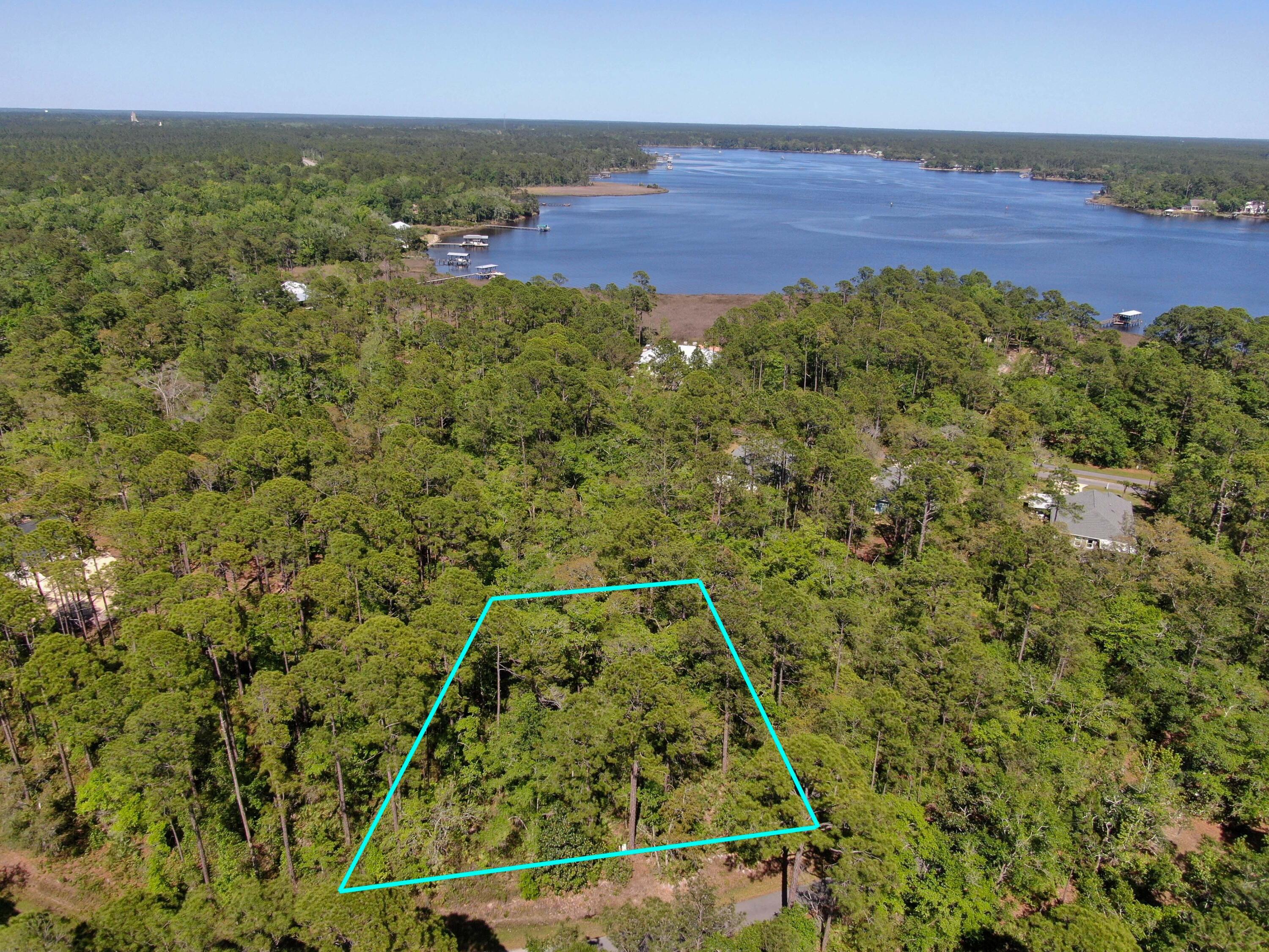Don't miss the chance to own a .45-acre lot in the sought-after Cross Creek Shores. The property is situated in an ideal location and is only a half-mile walk from the Lagrange Bayou. Plus, you won't have to worry about any HOA fees or build-out timelines. You have the freedom to choose your preferred builder and create your dream home with the bay's breezes. This lot offers a unique opportunity to build a custom home that perfectly fits the Florida lifestyle - boating, fishing, and relaxing in a hammock in a growing neighborhood while enjoying the peace and tranquility of the natural surroundings. The marina and the Oar House restaurant are just a short drive away, and you can reach the beach in just 20 minutes. Act now to make this lot yours before it's gone.