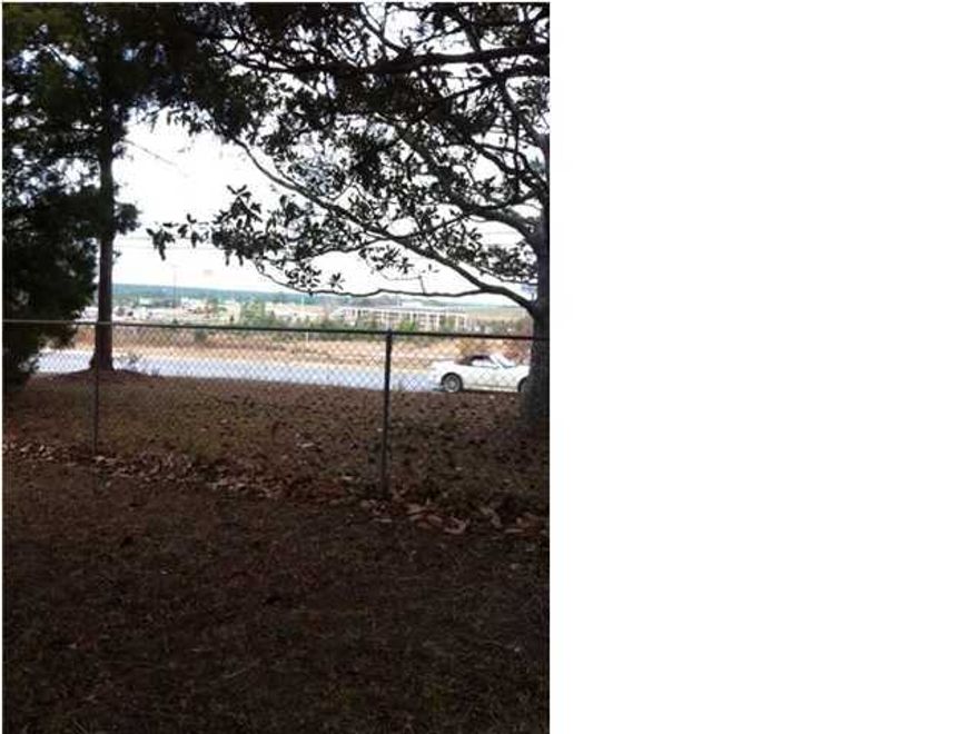 Property Is Zoned Commercial Mixed Use and is being sold ''AS IS''. This 2 Bdrm/1Ba Property Sits On A Nice Sized 1.36 Acre Lot. The Measurements For The Interior Rooms Are As Follows; Bedroom - 11.5x17.1, Bedroom - 9.3x11.3, Bathroom - 5.11x7.11, Living Room - 14.11x19.4, Dining Room - 8.7x9.5, Kitchen - 8.7x11.2. There is an electic self cleaning stove, dishwasher, and microwave, electric heating and air, a 500 ft. deep water well, septic tank, and 2 outside buildings. A new roof was put on in 1995. The measurements for Lot Dimensions Are Approximate.