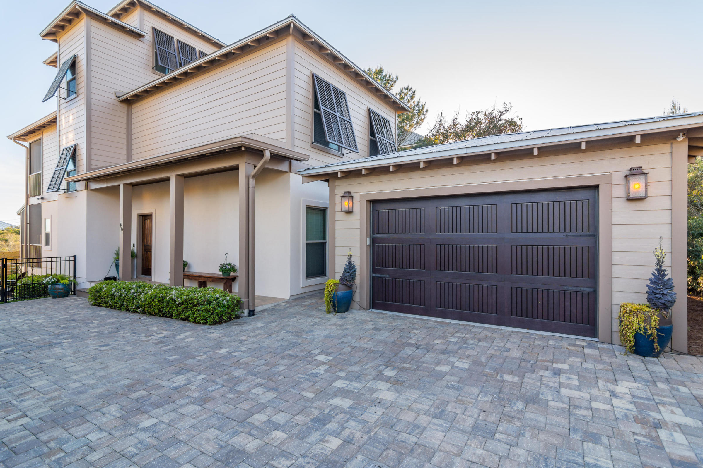This stunning Inlet Beach home is perfectly located for those who like an al fresco lifestyle. It has impressive outdoor living spaces with uninterrupted gulf views from the open and covered balconies. The inside of this beach home is equally alluring. It boasts custom fixtures and custom features which include crown molding, eclectic lighting, natural hardwood flooring and a security system. Sliding barn doors are cleverly used as features in the laundry and master bedroom suite. The open kitchen is fully equipped with state of the art appliances, whether you're preparing meals for two or entertaining on a larger scale. It includes an attractive marble breakfast bar and a hexagonal bay for casual dining with garden views.