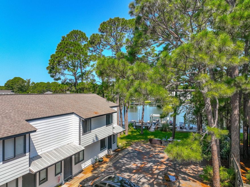 Renovated Buck Bayou water front unit with boat dock that hasn't been on the market in over 30 years! Located in a Waterfront four-plex with shared dock on Buck Bayou that leads directly to the bay! Unit has a deep water and deeded boat slip. Boat slip will hold appx. 24 foot boat with the draft being 4 to 5 feet. Development has 98 feet directly on Buck Bayou. Renovated 2 bedroom 1 1/2 bath with new paint, LVP flooring, updated kitchen and bathrooms and with a large deck looking out on the Bayou. Short term rentals allowed. Located in the popular and fast growing area of Mack Bayou and with close proximity to Sandestin. Perfect for short term rental, 2nd home or a week-end getaway.   Conveniently located to hospitals, restaurants, shopping, groceries and church.