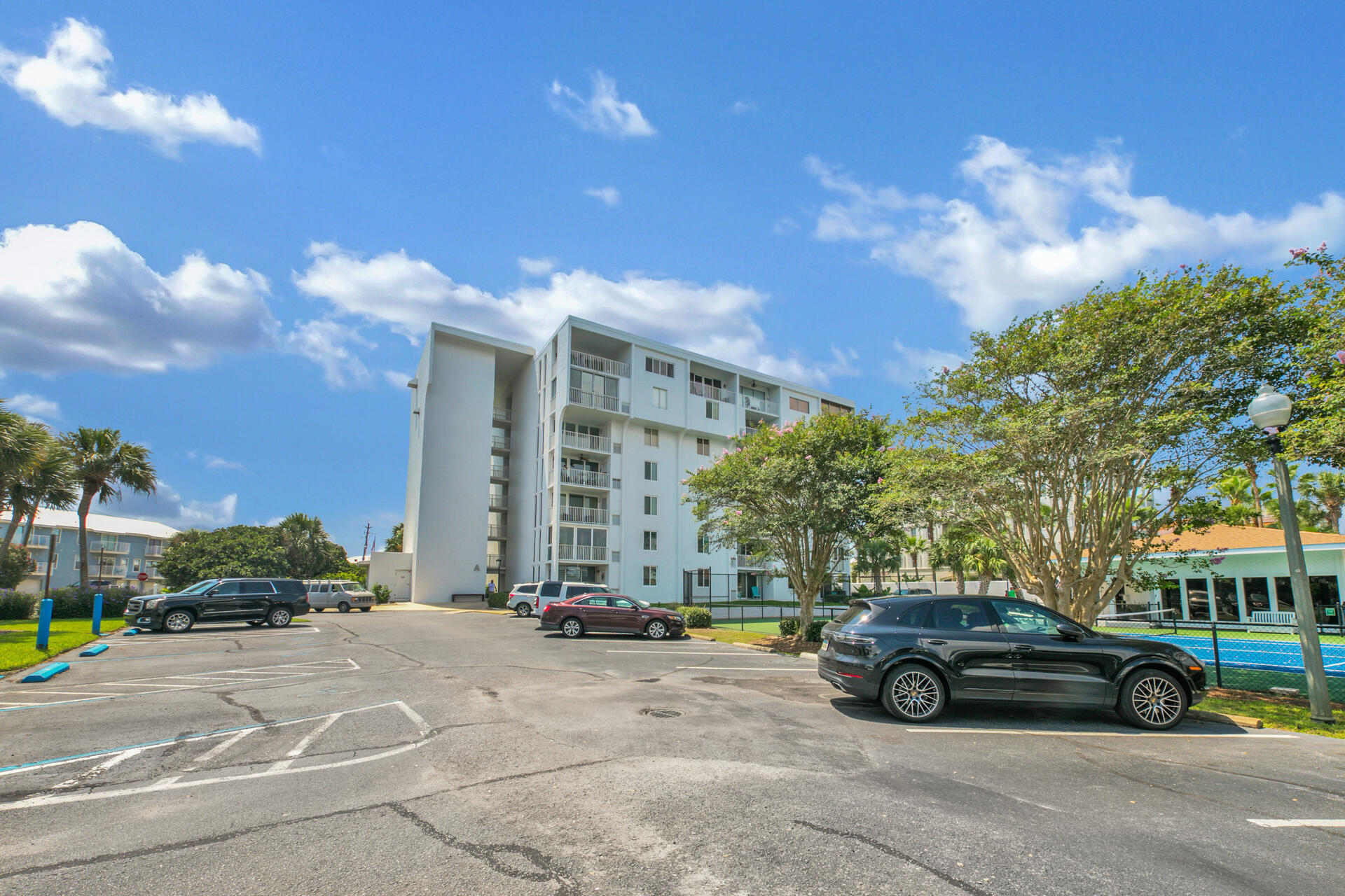 This fully furnished, harbor-side condo is a must see! Highlighted by new sliding glass doors and bedroom windows, vinyl plank flooring in the guest bedroom, and granite counter tops in the bathrooms/kitchen, this first floor unit allows you to sit on your porch and watch the boats drive in and out of the harbor or take a quick walk to the deeded beach-access just minutes away. Other highlights include a gated community pool and spacious pool house that has incredible views of the harbor, making for the perfect place to watch the sunset. This unit is also coming with a 12 foot, two person kayak, two paddles, and three life vests. Whether you are looking for a primary home, second home, or investment property, this is a fantastic opportunity for you. Come show today!
