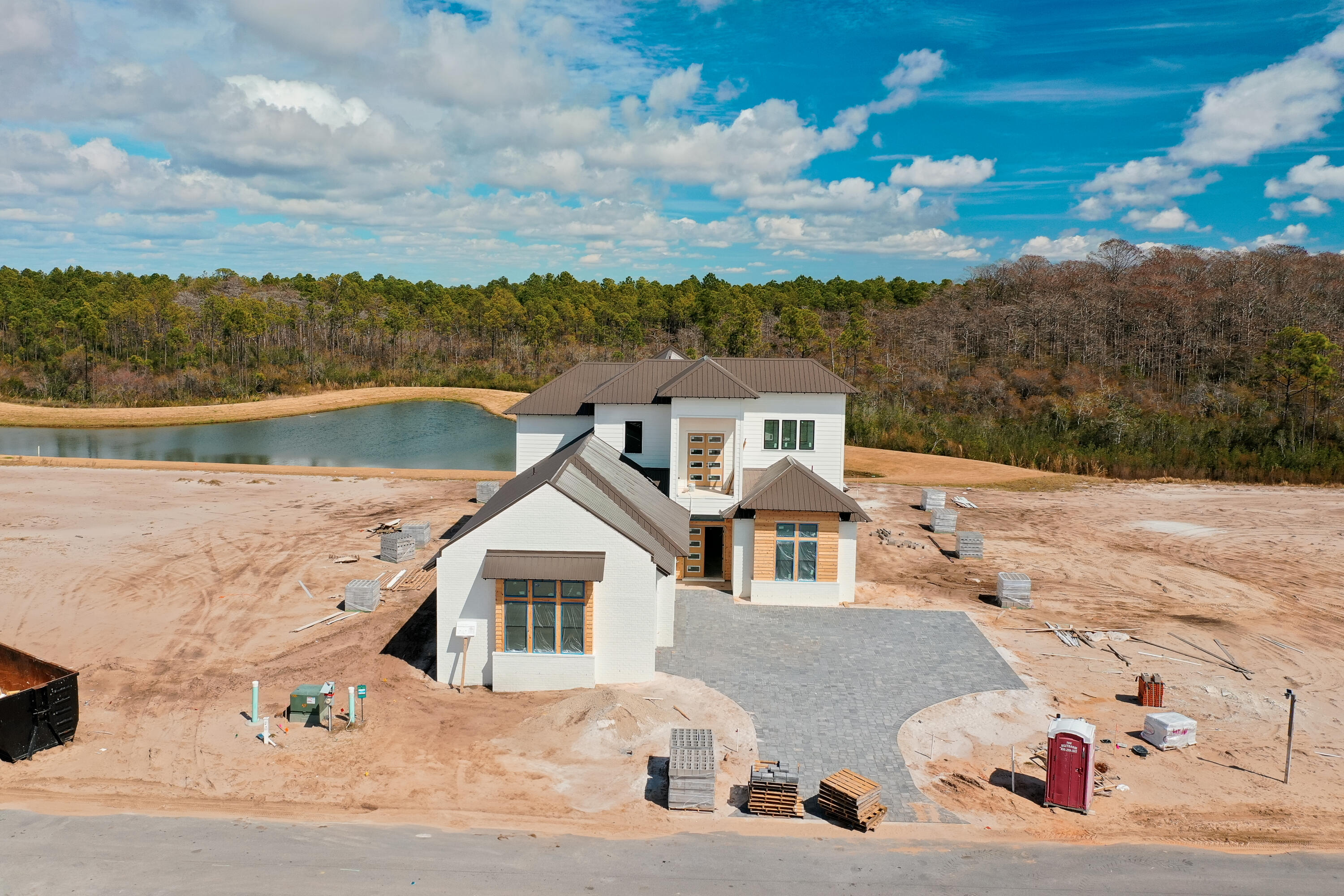 Designed by renowned architect John Williams, this elegant new construction--nestled behind the private gates of Camp Creek--showcases impeccable craftsmanship paired with refined coastal charm throughout. The kitchen is a chef's dream, featuring custom-milled cabinetry, an expansive island, quartz countertops, and a luxury appliance package complete with a gas range. Flowing seamlessly from the kitchen, the spacious living and dining areas provide direct access to a covered porch with an outdoor kitchen, blurring the lines between indoors and out to create a continuous space for both relaxation and entertaining. On the first level, the master suite facing the pool is strategically positioned and accompanied by a spa-like ensuite with dual vanities and a custom-tiled wet room, while two additional bedroom suiteseach with its own dedicated ensuitecomplete this level. Ascending to the second floor, the breathtaking main suite offers a private porch perfect for savoring the mesmerizing hues of the famed Emerald Coast sunsets each evening, along with a sumptuous ensuite that creates a true oasis.

56 N Southern Cross Lane  is paired with a WaterSound Club Membership, granting exclusive entry to the acclaimed private beach club and access to some of the area's finest golf coursesincluding Camp Creek, Sharks Tooth, Origins, and the upcoming Davis Love course. This rental-restricted community also boasts exclusive access to a newly constructed amenity center featuring dual pools, a lazy river, pickleball and tennis courts, a wellness center, and an on-site restaurant.

Strategically located between Scenic Highway 30A and Highway 98, the WaterSound Camp Creek community provides convenient access to the iconic town centers of Alys and Rosemary Beach, along with a vibrant array of world-class dining and entertainment options along 30A.

Situated directly across Highway 98, the WaterSound Town Center hosts events such as a weekly Farmer's Market and features a Publix, an assortment of restaurants, a STEAM school campus, and medical offices.