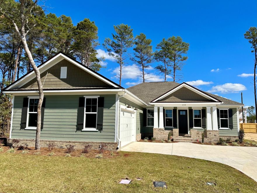 New, Florida Cottage Style home in Niceville's newest and largest subdivision, Deer Moss Creek 4 BRM & 2.5 BTH, 1 story home w/ 2,260 square ft. 1 bedroom in the front could be used as an office. Sought, after open floor plan w/a separate dining rm/flex room off living room. All wood, white shaker style cabinets, white quartz counter tops & Kitchen Aid appliances. Apron front sink & tankless, hot water system. Spacious master bedroom and bath w/ double vanities, a deep, spa-like, soaker tub and a walk in, tile shower. Master closet has white, wood shelving system.10 ft ceilings & custom, bamboo blinds. Screened in, back porch and a fenced backyard.