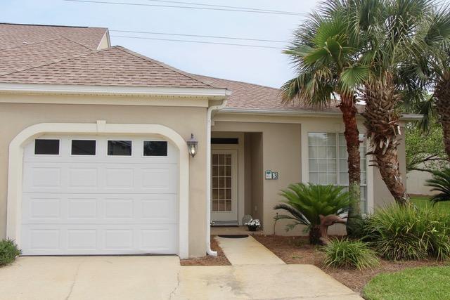 This immaculate town- home has been a well cared for and treasured second home. It has been painted and carefully prepared for the market and is ready for it's new owner. Granite counter tops, stainless steel appliances, tile floors in main living area and carpet in the bedrooms make for very comfortable living in a very convenient location! French doors lead out to a screened and covered porch and a nice green space. Association fee's include exterior maintenance, groundskeeping, sewer, water and pool and tennis amenities.