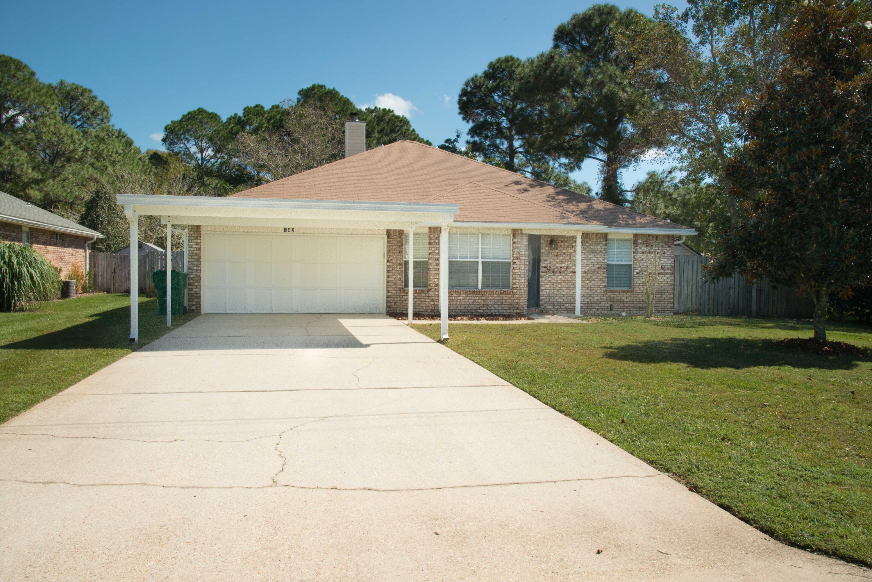 This spacious home offers convenient access to Hurlburt Field and features an open, functional layout ideal for comfortable living. The kitchen is equipped with ample counter space, a breakfast bar, and flows seamlessly into the dining area. A skylight and large window allow the space to have natural light, creating a warm and welcoming atmosphere.The generous living room features a cozy corner fireplace and offers plenty of space for both relaxing and entertaining. The master bedroom provides private access to the Florida room. Additional highlights include a large two-car garage and a sizable, privacy-fenced backyard with ample room to enjoy the outdoors. All Coastal Realty Services residents are enrolled in the Resident Benefits Package.