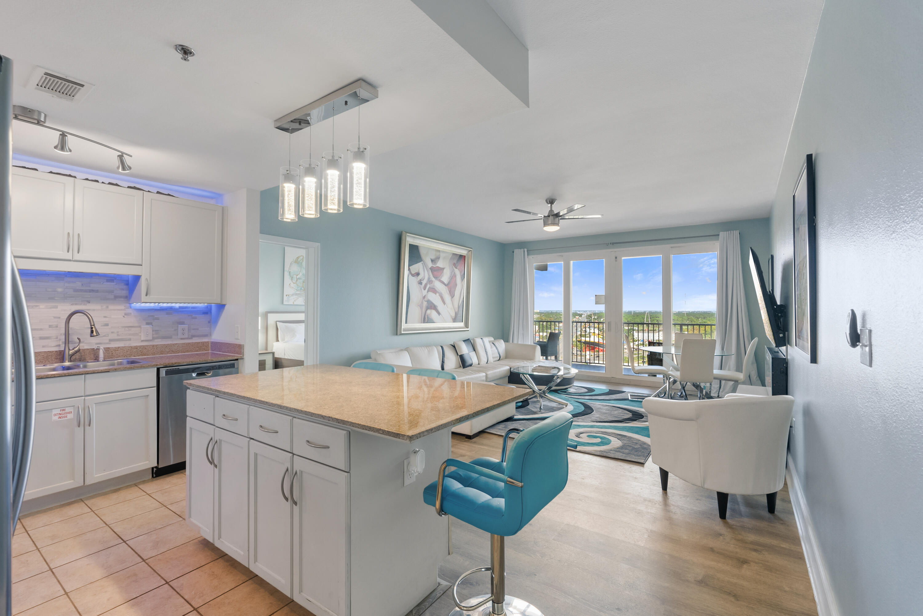 Fully renovated turn-key 3BR/2 BA condo in the beautiful Laketown Wharf Beach Resort.  This 1262 sqft unit offers spectacular city/lake views from the 15th floor!  This unit has been continuously profitable: 2021/$61,569, 2022/$50,499, 2023/$52,499, 2024/$39,201.  Can be used as primary residence, short term rental or investment property AND this unit is being sold FULLY furnished - with no exclusions!  Everything you see in the photos and viewing is being sold with the property.  All furniture/linens/tv's/appliances/etc - turn-key and income producing!  Step into the coastal ambience of this beautifully themed condo with touches of rich blues, whites, and creams.  Your kitchen gives ample space to cook up that delicious meal as you return home from the emerald coast waters and white sugary sands of the PCB coast, all just a few minutes walk, with convenient access for Laketown Wharf guests.  Your kitchen features white cabinets, granite countertops and LED lighting throughout.  Nestled close by you can relax on your large oversized couch, next to your electric fireplace with a large TV above.  Step onto your private patio, overlooking Panama City Beach with gorgeous city and lake views below.  Be mesmerized each night by the fountain and light show dancing on the lake waters below, right next to the boardwalk, where restaurants and shopping line.  Soak up the rays during the day, all enjoyed in the privacy of your own balcony deck with views most dream of.

Escape to your master suite with adjoining master bath and soak your cares away in your large master soaking tub.  Master bath also includes dual vanities and shower.  Step out your doors of your master suite right onto your private balcony. The extended balcony can be accessed from the living room and the master suite! 

There are two additional bedrooms with a shared bathroom, also with a shower and tub combo.

This unit sleeps 6 comfortably but can accommodate up to 10 people so it's perfect for large families and entertaining.

Laketown Wharf Resort is in the heart of all the fun & excitement of Panama City Beach.  Just steps away from the world's most beautiful white-sand beaches, shopping, dining and entertainment.  Amenities include: convenient beach access, 5 unique pools, a kids funscape playground, Splash Bar & Grill, Gulf View Fitness Center & covered garage parking. Laketown Wharf Offers A Variety Of views Including The Gulf Of Mexico, Lake & Golf Course. Enjoy the nightly fountain & light show & market shops along the 52,000 sqft Of Lakefront Boardwalk. 