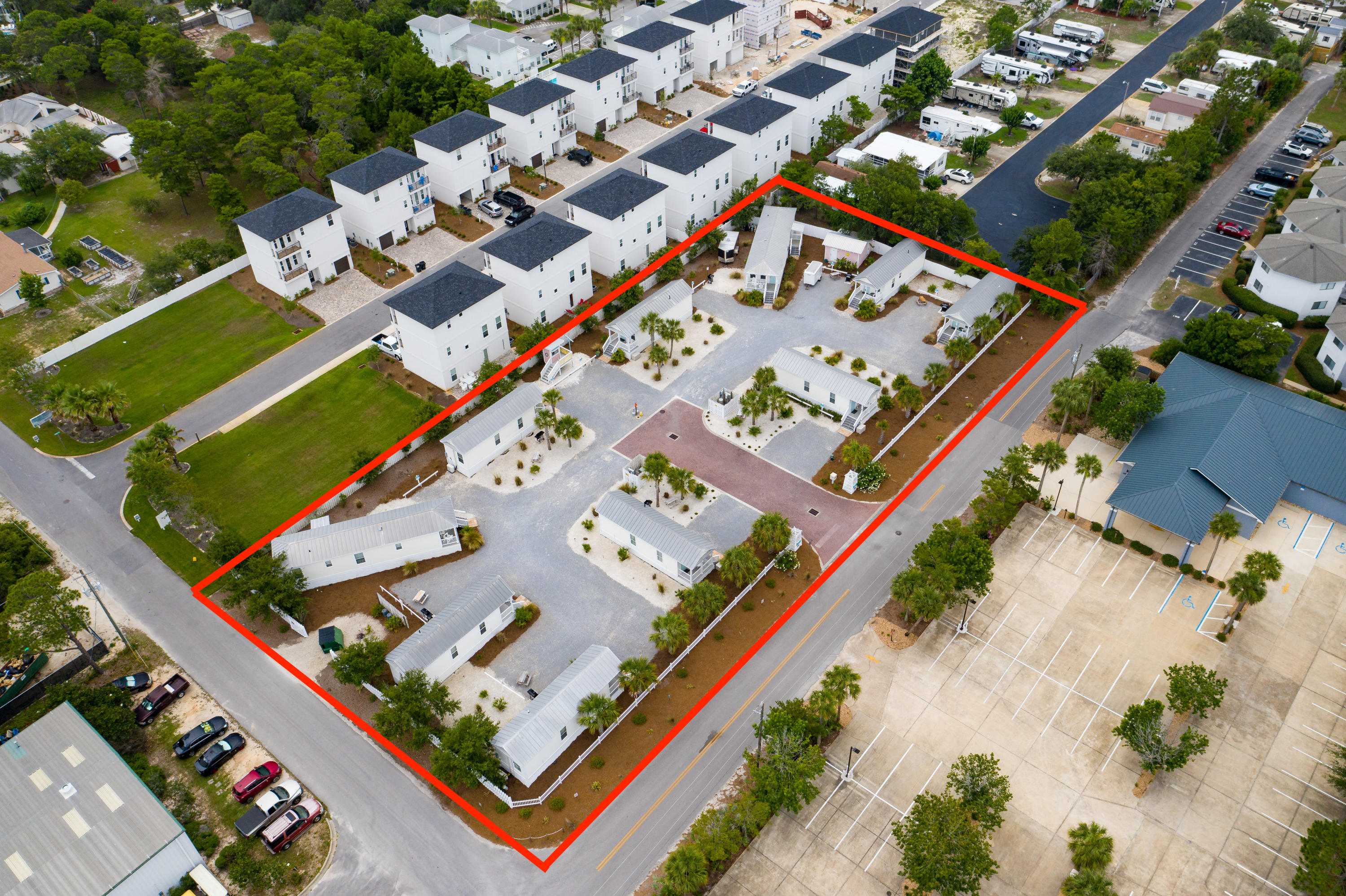 With an average review of 4.8 stars, plus 2018 gross rental income of 224K and 2019 of 213K, this income-generating property is a must see! The 10-unit community is beautifully landscaped and each cottage has been well-maintained with upgrades to kitchens and bathrooms in late 2019. There are 8 one-bedroom, one bathroom (396 square feet, sleeps 4) and 2 two bedroom, one bathroom (728 square feet, sleeps 6) modular built cottages. All cottages have a full kitchen, walk-in shower, sleeper sofa, dining area and A/C. Each cottage has a private sitting porch, dedicated parking space, outdoor grill, picnic table, Direct TV and high-speed wireless internet. There is potential for a buyer to remove the existing cottages and built 10 single-family dwellings. Buyer to verify all information.