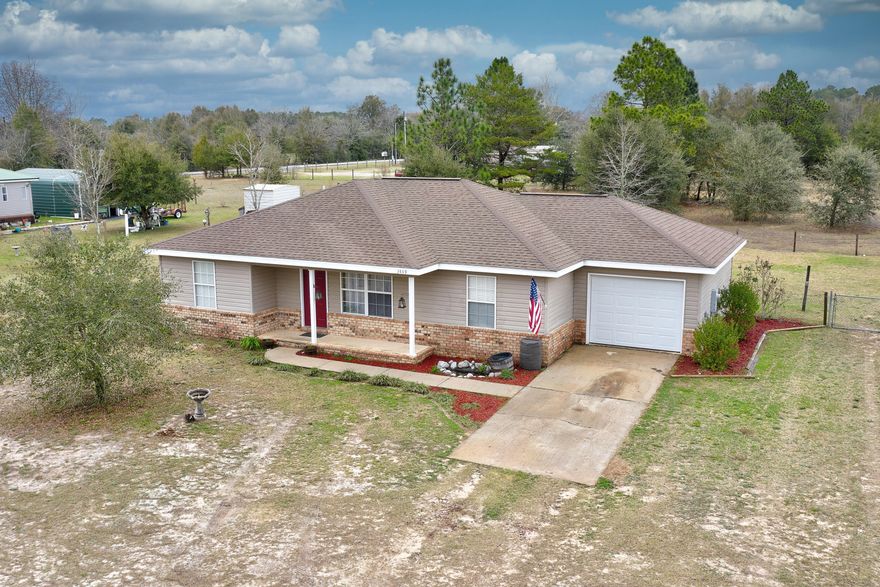 Welcome Home! This 3 bedroom 2 bath property sits on a full acre of land in North Crestview. Spend your nights and weekends enjoying that country feel but know that you are just minutes away from Crestview High School and the North End Publix. The home features a split bedroom floorplan. The primary bedroom has a large walk-in closet and an en-suite 3 piece bath. On the other side of the home are the additional bedrooms and a hall bath. The ceilings are tall, enhancing the open flow of the living room/dining room/and kitchen.