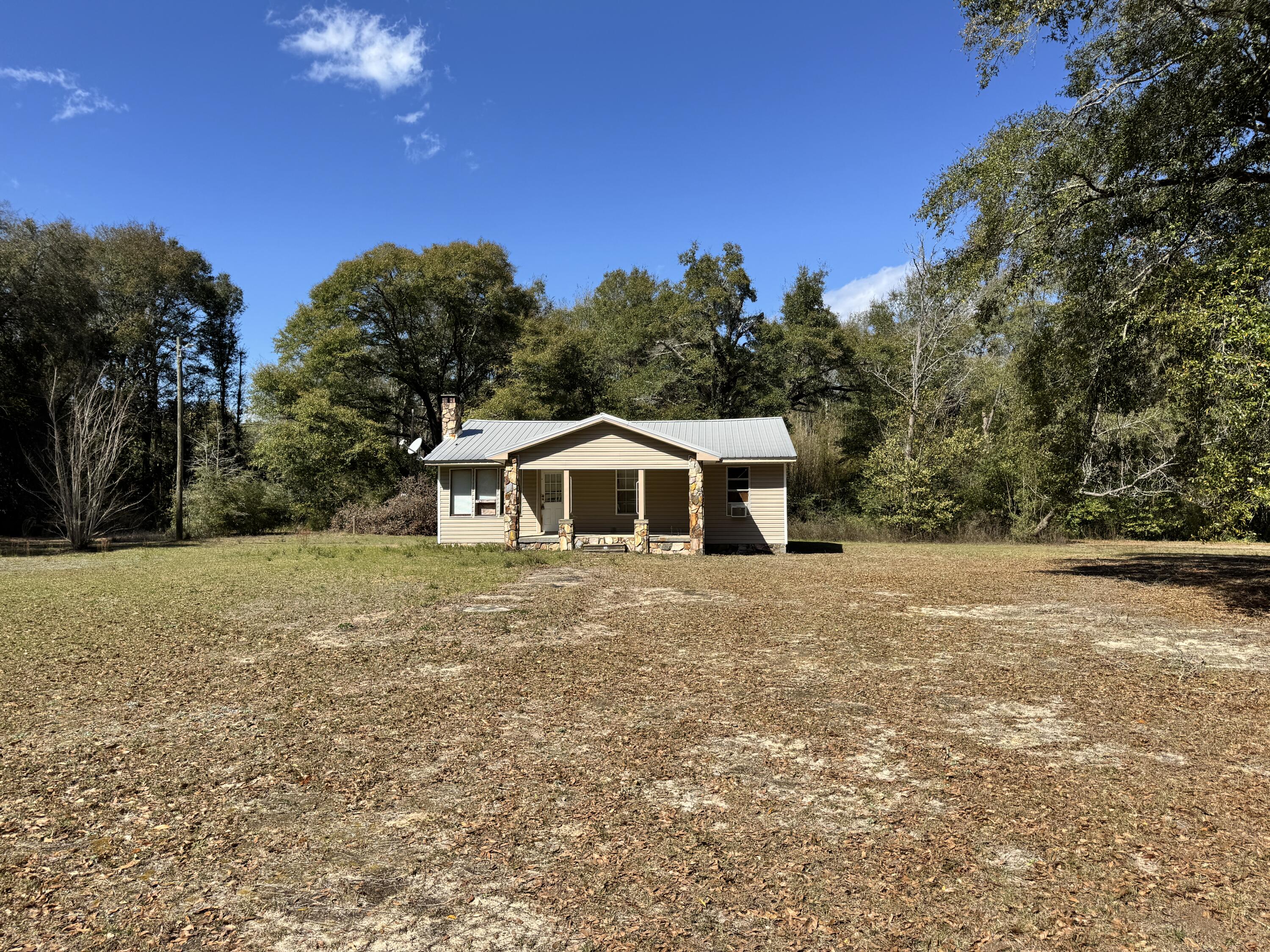 Gorgeous, nearly 3 acre property (final size to be determined by survey) in north Crestview. Property is zoned Mixed Use, per zoning dept. up to 4 homes per acre with Development Order. The home has potential, but needs quite a bit of work. The land, with it's gorgeous old oak trees, is the real star!