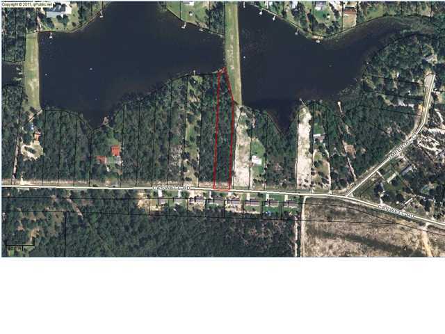 Beautiful waterfront lot. Almost 1 acre lot. County maintained roads with city water.