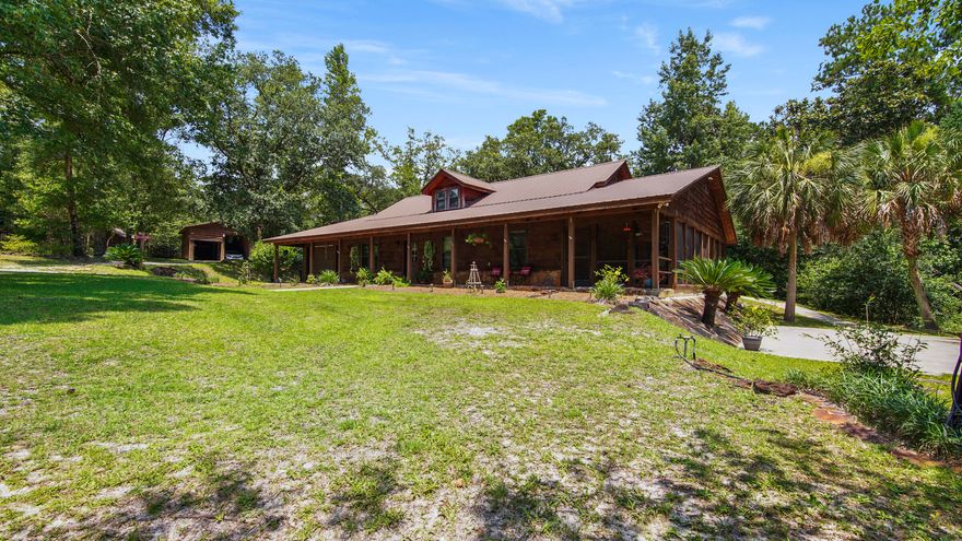 Welcome to 3809 East State Highway 20. A park like setting that is one of a kind. This 11.81-acre homestead, lovingly known as Gypsy Wilde Farm, offers Old Florida charm and beauty that is close to everything Walton County Florida is famous for. Here you will find a thoughtfully developed and useable property that you will never want to leave. The Farm is highlighted by a list of must haves. There is a large Garden inside a high fence with a Greenhouse, positioned next to an Orchard with a variety of fruit trees. Two ponds are situated amongst green, manicured grass and are stocked with Bass and Bream. The year-round Creek with a walking trail runs through the length of the property. Multiple out buildings include a Barn/Workshop with ample storage inside/out and parking under roof, an RV