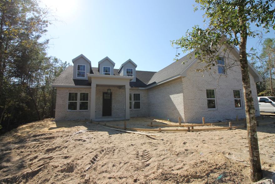 This amazing 4 bedroom 3.5 baths home with Office, game/media room and bonus room that is located in one of the most sought after subdivision in Bay County, Lake Merial. This neighborhood provides underground utilities, sidewalks, many park like areas and lots of friendly neighbors, This home offers a Large open living space with 10 ft. ceilings, breakfast bar, stainless steel appliances, granite countertops, Custom Cabinets, Custom Rangehood, wall oven and cook top and oversized covered porch. The master suite features raised ceilings, nice walk in closet, double vanity in Master Bath, separate tile shower, and soaker tub. Don't miss this amazing home! Come see it today! NO CONSTRUCTION LOAN NEEDED!