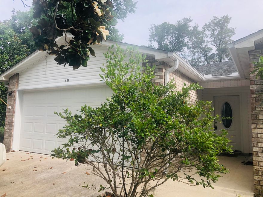 Great location!! Minutes to Hurlburt, Schools, restaurants, shopping & the beach. Recently updated 2 bed, 2 bath, end unit w/open floor plan. Tiled living & bathrooms w/ carpet in bedrooms. The kitchen has granite counter tops, new SAMSUNG stainless appliances, new sink, faucet, & modern painted cabinets. Master features 2 new vanities w/granite tops. The second bedroom is conveniently located near the hall bath matching the new master updates. Master has 2 closets. 2 car, attached garage gives plenty of room for vehicles, projects, & laundry. The covered patio area is perfect to unwind or host guests. Large open yard with long side yard. Beautiful tree off back porch for added privacy. New HVAC system installed 2016, new lights, exterior doors, and so much more. Won't last long, call tod