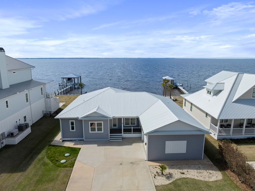 Beautiful bayfront custom built, Multi-generational home situated on just shy of a half acre lot. Site offers 80.68 feet of waterfront footage along the Choctawhatchee Bay in Bay Harbour Subdivision. This custom built home features open living, boasting incredible sunset views from the wall of windows that encompass the rear of the home. Main living includes 2 bedrooms, 2 baths, plus an office/ flex room, open living to include a well appointed kitchen. The kitchen features solid surface counters, white shaker cabinets and stainless steel appliances. Enjoy your prefered beverage on the screened porch that encompasses of the entire rear of the home, taking advantage of all living on the bay offers. The attached mother-in-law suite with access from the interior of the dwelling as well as a private exterior entry inlude 1 bedroom 1 bath, a full kitchen and living area with its own private screened-in back porch.