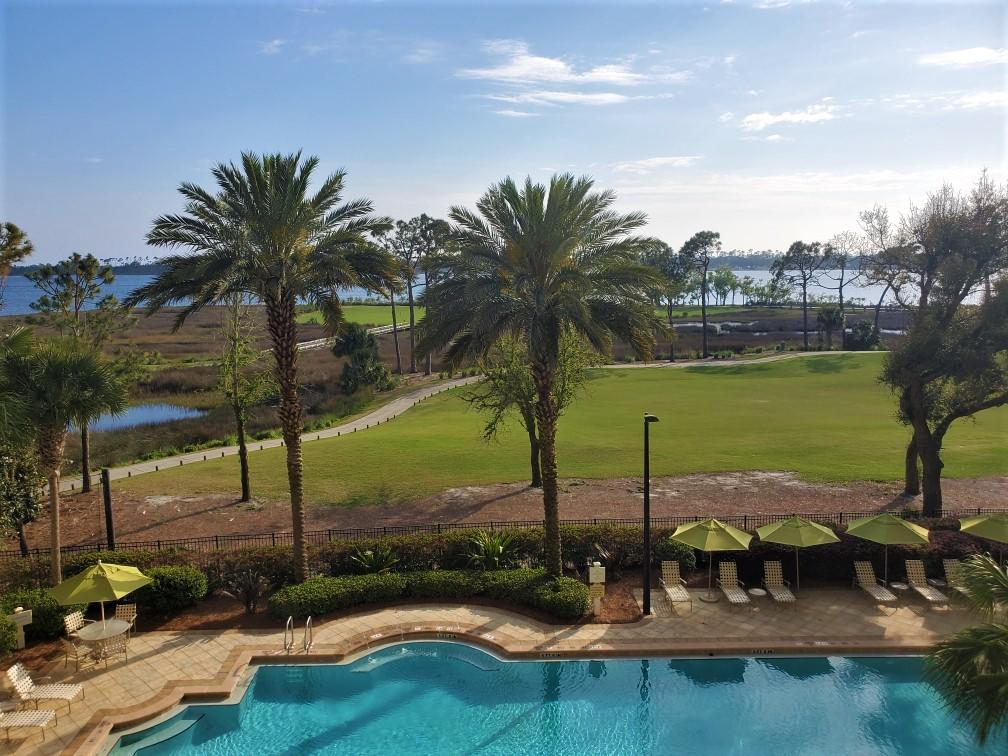 enovated 4th Floor Grand Residence condo in the Bay Point Golf Community! This is a 2BR/2BA split-bedroom with den/office unit. New porcelain plank ''driftwood'' flooring with premium waterproof soundproofing, new carpet in the bedrooms rooms & den, freshly painted ceiling and walls, new quartz countertops in kitchen and bathrooms, new cabinets and fixtures, all stainless steel kitchen appliances including new Samsung fridge and KitchenAid quiet dishwasher, new hot water heater, and front loading Samsung washer/dryer. One reserved parking spot and private storage room on same floor. Amenities include: pool, gas grills, hot tub and covered lanai with pool tables a fireplace, community/meeting room, and a hi-tech fitness center! This would make a great home for those seeking a low