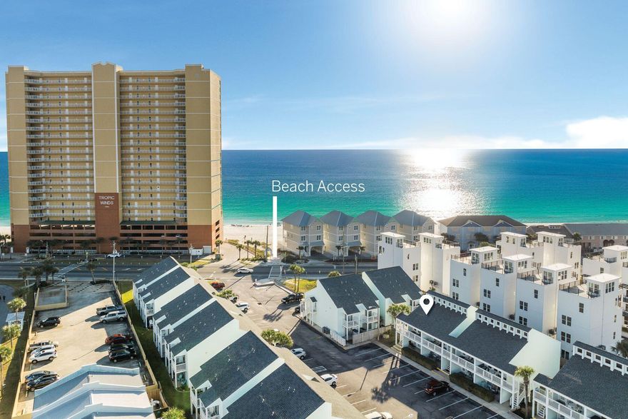 Experience the ultimate Gulf Coast retreat with this beautifully designed loft-style condo in Panama City Beach. Located in the sought-after Southwind community, this property combines modern comfort with coastal charm, making it an excellent choice for a second home or investment. The living room boasts vaulted ceilings, tasteful furnishings, and an abundance of natural light, creating a warm and inviting atmosphere. The modern kitchen, fully equipped for all your culinary needs, flows seamlessly into the living area. The master bedroom features its own private balcony, an ideal spot to unwind and enjoy stunning sunsets. Sold fully furnished, this condo is ready for you to move in or start generating rental income immediately.
