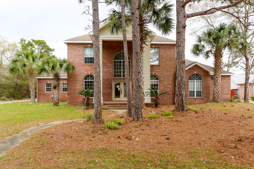 Contemporary home in the Florida panhandle sits on a mature 0.5 acre lot. Home was built in 1997 and offers 5 bed, 2.5 bath, with 3035 square feet of living space, and an attached 3 car garage. The back patio needs tp br repaired but an easy project for the weekend warrior. The home features custom built ins with modern flair, hardwood floors, and ceramic tile in the eat in kitchen. Kitchen needs some cosmetic updates but has a great quartz counters, double wall ovens, electric cooktop, and ample storage. Would take minor changes to make this your dream home while allowing you to add your own design style. Come take a look and make an offer today!