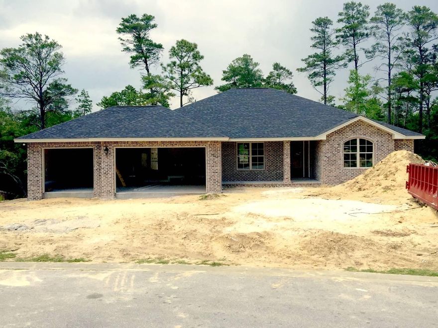 Exterior Features: All Brick, recessed lighting in soffits, 3 car garage, screened in porch, large wood deck off back porch, full landscaping & irrigation, gutters, brick mailbox.Interior Features: 9' ceilings with tray ceilings in living and master, 8' doors throughout, crown molding in main areas, 5 1/4'' baseboards, 42'' upper cabinets with crown molding & under cabinet lighting, Soft close cabinet drawers, granite kitchen counter tops, stainless steel kitchen appliances, recessed lighting in kitchen, living, foyer, and halls, marble bathroom vanities & tub/showers, carpet in bedrooms, tile in wet areas, laminate wood flooring in all other areas, window trim in all main areas, eggshell wall paint throughout, framed bathroom mirrors,And many more.