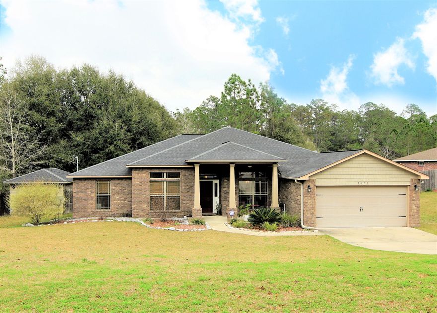 Looking to get away from those crowded neighborhoods? Need room to spread out? This 5 bedroom home located on 3/4 acre has all that and more. Entering the home, the entry and formal dining room open to an oversized living area with room for your sectional, highlighted by a custom wood accent wall. Bonus room along the back of the home can be used for a den, office or playroom, and can be shut off with the custom sliding (barn) door. Check off your wish list with the large kitchen: granite, stainless appliances, plentiful wood cabinets, and an island work area. Split bedroom plan - master suite and guest bedroom and bath both separate. The lot backs to a 47 acre natural area with a creek flowing directly behind the property. Would you like your own fresh eggs and garden veggies? There is a