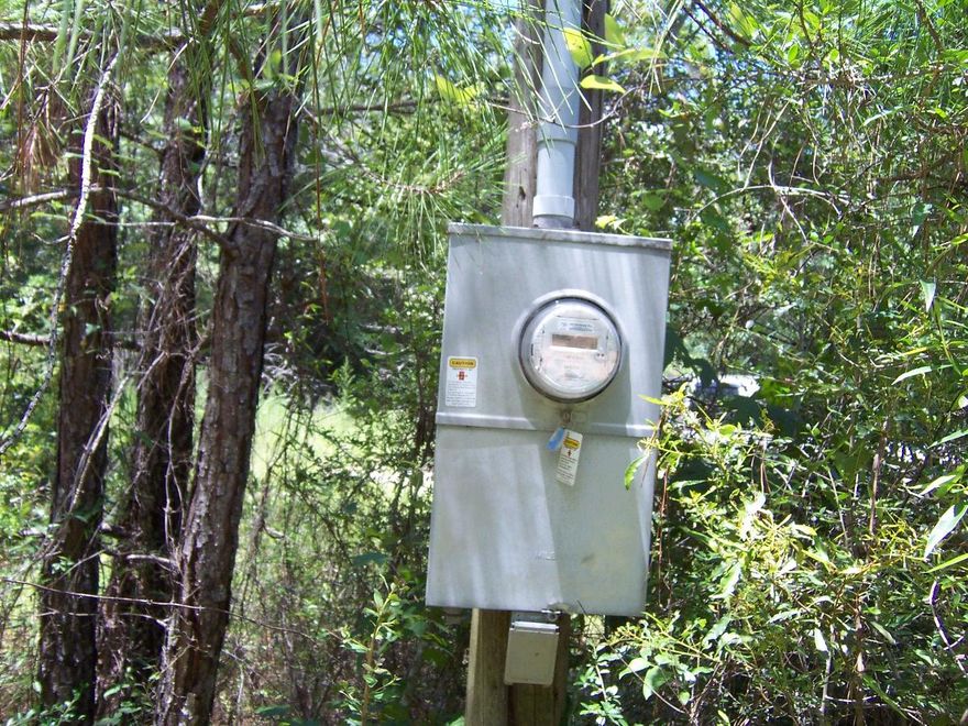 4.5 acres on paved road with septic and power pole. Was used to park an RV. Partially cleared. Corner lot. Close to town and beaches of South Walton. Paved Road Frontage. Nice wooded duck pond on property.