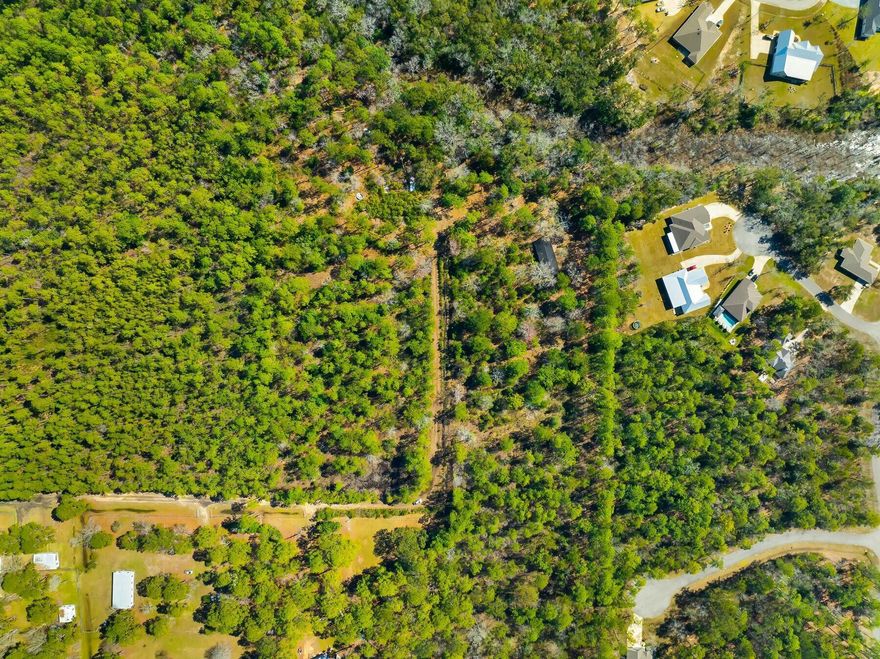 This unique offering includes 9.53 acres on four contiguous lots being sold together, perfectly situated in the heart of Freeport. Ideal for those seeking a blend of privacy, land ownership, and proximity to the stunning beaches of South Walton, these lots offer the best of both worlds. Each lot is spacious and zoned to accommodate a single-family home, providing the perfect opportunity for multi-family living or investment. Whether you're looking to build a family compound or multiple homes close together, this is the ideal canvas for your dream property. With easy access to the beach, shopping, dining, and entertainment, yet tucked away in a serene setting these lots offer endless possibilities. Don't miss out on this rare chance to own prime land in one of the most desirable locations.