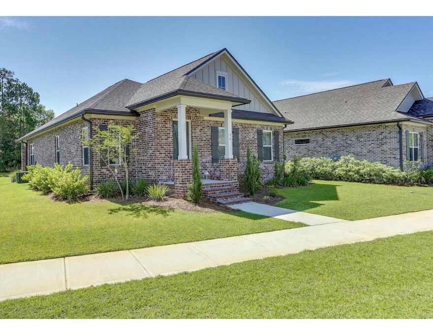 Charming home within walking distance to full service deep water public marina.  This home built by one of the areas most respected builders, Randy Wise Homes and is filled with must have features. Craftsman style architecture, brick exterior,  wood floors, crown moulding and base moulding, cased windows, 9' ceilings.  Woodharbor, furniture grade cabinets, granite counter tops.  Tile in all bathrooms.  Large kitchen with stainless appliances.  For the buyer who is looking for quick access to the water and a great value this is a must see!!