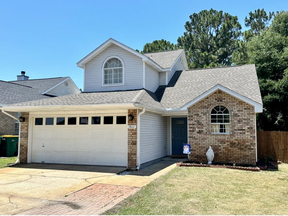 This 2 story home welcomes you with extra parking up front.  As you walk in you'll notice the wood grain vinyl flooring, kitchen with breakfast nook/dining area that opens up to the living room complete with a wood burning fireplace.  The master bedroom is on the 1st floor and 2 additional bedrooms with 1 full bath are upstairs.  Every room has a walk in closet and the kitchen features granite countertops, white tile backsplash and stainless steel appliances!Enjoy your coffee on the oversized back deck and peace of mind knowing that no one lives behind you!