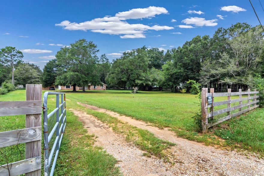 Country living at it's best! This charming Baker home is located on just over 2 acres of fully fenced, private property! Enjoy a cup of coffee on your covered front porch, overlooking 1 acre of partially cleared front yard space. The backyard features an additional 1 acre (all the way to the tree line) and comes complete with an oversized shed (electrical already in place).The location is convenient-minutes to grocery store,post office, & restaurants of Baker. Property is also an easy 10 min drive to I-10. This home is carpet free (LVP/tile throughout), granite countertops, and newly painted cabinetry. Newer HVAC (2017). The garage area has been converted to a 4th bedroom/separate living space and offers privacy from the rest of the home. Additional 3 bedrooms are ample sized (MORE Carport has parking for 2 vehicles, plus additional storage shed attached to the rear. Chicken coop + 9 chickens (1 rooster, 9 hens) to convey with the home. There is additional fencing already partitioned off for horses, gardening, etc. This property offers up so much potential to create your FL homestead, all while being close to I-10 and the beaches/rivers of Okaloosa County!