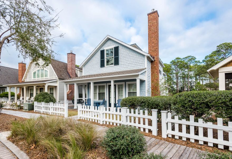 Wooden pathways and white picket fencing lead you to this welcoming 3 bedroom, 4 bath WaterSound Beach Cottage. A large covered front porch greets you as you enter the home's great room with soaring ceilings and expansive windows allowing in tons of natural light. The gas fireplace is complemented perfectly by the marble accented mantel and wainscoting sprinkled throughout this home. The open concept floor plan was made to entertain and comes equipped with a large dining room, breakfast bar, spacious kitchen and a screened in porch conveniently located off of the dining area. The kitchen's granite counter tops, tub sink, GE Monogram Series stainless steel appliances, recessed lighting and crisp white cabinets complete the space effortlessly.