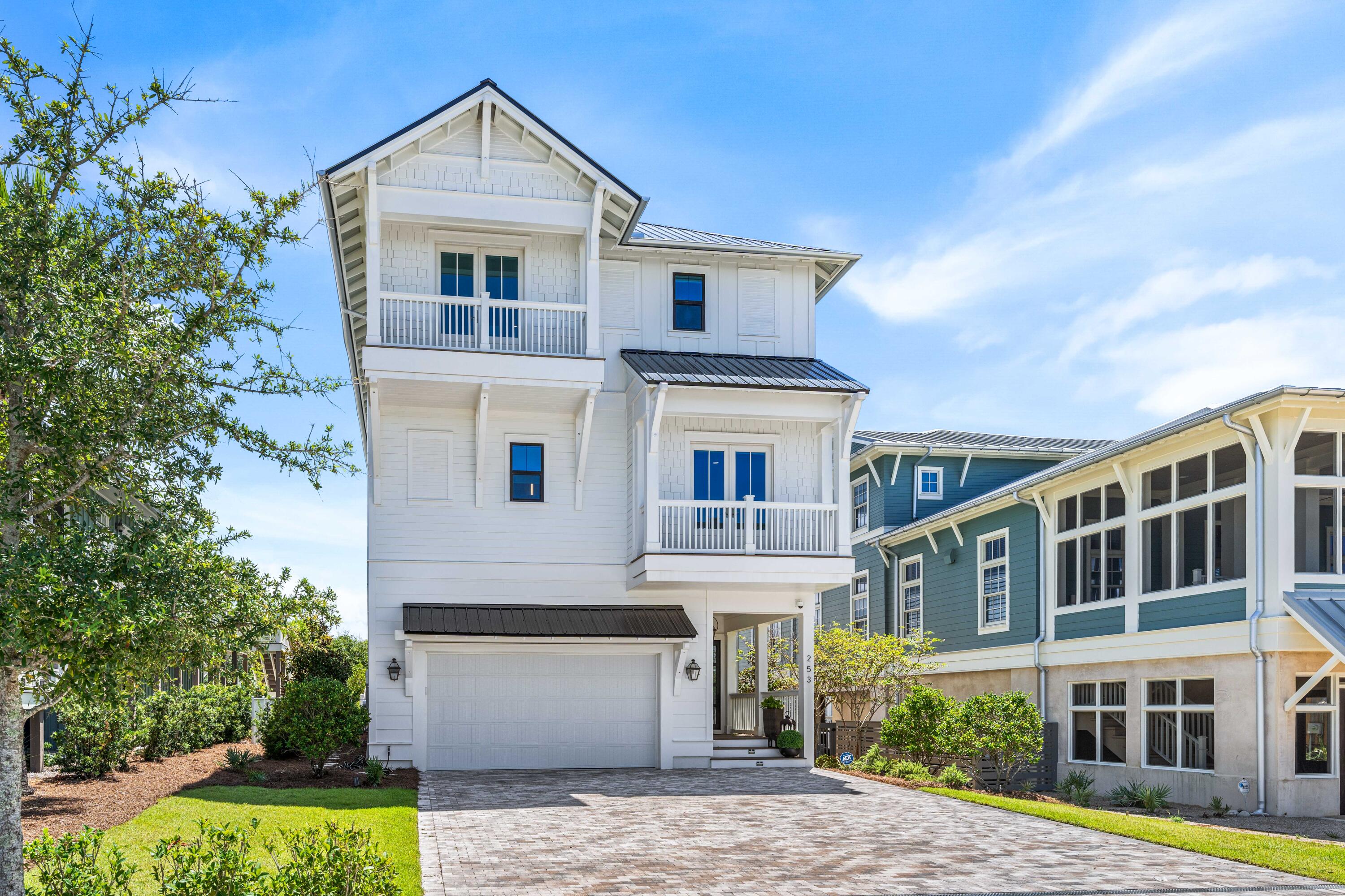 **Grayton Beach Luxury Home with Dune and Gulf Views**Experience the epitome of coastal living with a contemporary flair in this stunning, professionally decorated 5-bedroom, 5.5-bathroom residence.  This home offers 4,385 sq ft of luxury open living spaces spanning across 3 floors and complete with an elevator for convenience. Interior features top-of-the-line Viking and Sub-Zero appliances, ensuring a chef's dream kitchen, engineered hardwood flooring throughout, beverage station on 2nd floor and luxurious baths with marble finishes.  Enjoy an additional 2,324 sq ft of outdoor living spaces including summer kitchens on the 1st and 3rd level porches.   Perfect for entertaining or relaxing by the private swimming pool. Property  includes a two-car garage and ample parking for 4- additional vehicles on the pavered driveway. Just steps away from Grayton's pristine white sandy beaches and the Gulf of Mexico.  A short walk or quick bike ride to shopping and dining.  
Indulge in the serenity and beauty of Grayton Beach while watching the sunset from the roof top outdoor living space.  This custom home has never been on a vacation rental program, in perfect condition and designed for the ultimate in comfort and style. 
