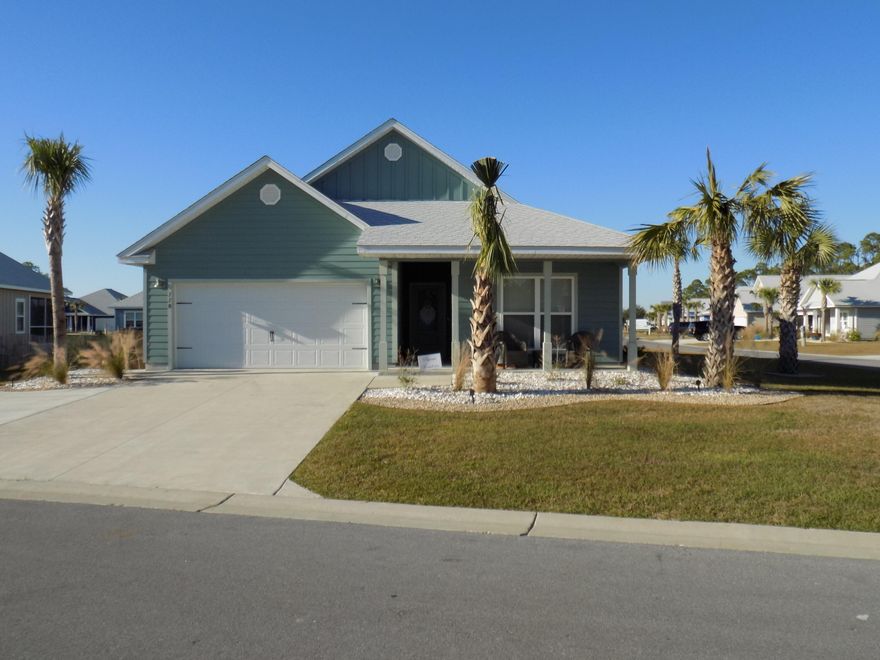 This beautiful 4 bedroom 2 bath Delray floorpan in WindMark Creekside is an easy walk or golf cart ride to the beach! This home is amazingly landscaped with oyster shells and rock and features an extra parking pad for guests.  It sits on a large corner lot and is a stand out! Relax on your screened porch after a day at the beach.  Enjoy all that WindMark has to offer with it's downtown shops, gym, community pool, beach boardwalk, bike trails, playground and The View on Old 98 restaurant that features panoramic views of the bay.  This home has never been rented and is in pristine condition!  It is being sold unfurnished.  Just a few miles from quaint downtown Port St. Joe with many shops and restaurants to enjoy as well.  Spend this Christmas in your new beach home!