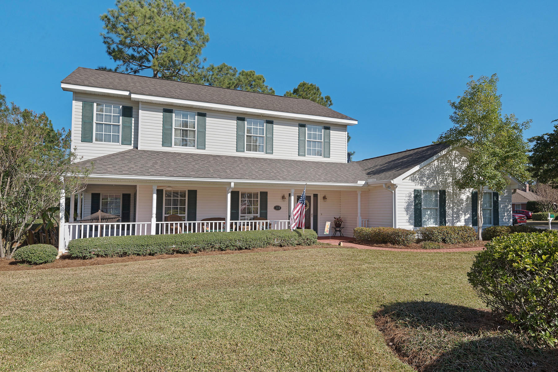 ''The Pottery Barn House'' situated on a large corner lot in the desirable gated community of Southwind in Bluewater Bay! From top to the bottom and everything in between this home has been upgraded. The Southern style covered, brick paver front porch welcomes you. The foyer opens to a spacious living room with crown molding and beautiful hardwood flooring throughout. Large family room with cathedral ceiling, gas fireplace with custom mantle and built-in bookcases surrounding a large picture window. Expansive laundry/utility room with extra storage.Gourmet kitchen with custom cabinets, undermount cabinet lighting and a built-in desk. Stainless steel appliances including French door refrigerator with water and ice in door, granite countertops, gas cook top and center island.