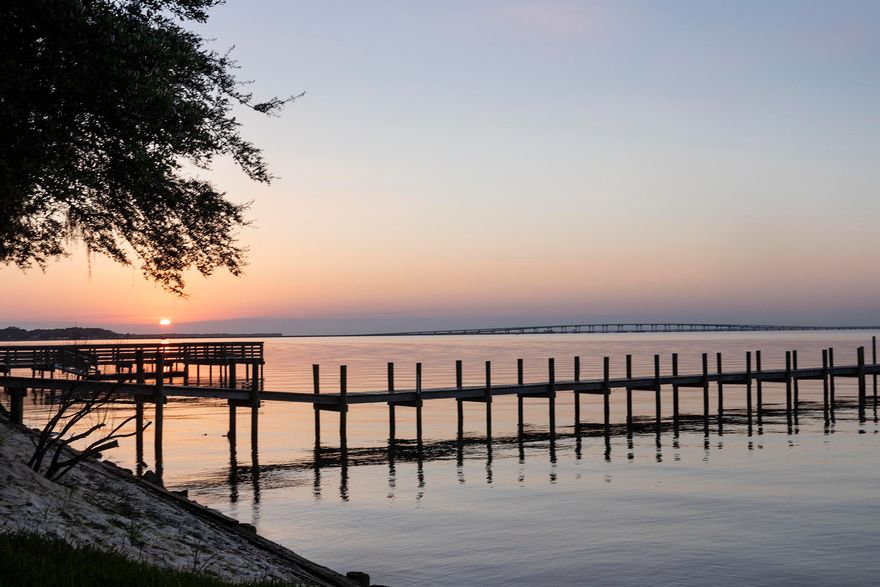 Beautiful, waterfront, lot on Choctawhatchee Bay (high & dry) with 61-feet of frontage; and, it comes with a small cottage! This 'Studio Cottage' is perfect for a weekend getaway, or long-term rental while deciding plans for new construction. Pretty trees, seawall, paid utility connections and new privacy fencing in a convenient location to schools, shopping, and everything 30-A has to offer.***Buyer is responsible for personally verifying details about this property. Any information contained in this listing is believed to be accurate but is not guaranteed.***