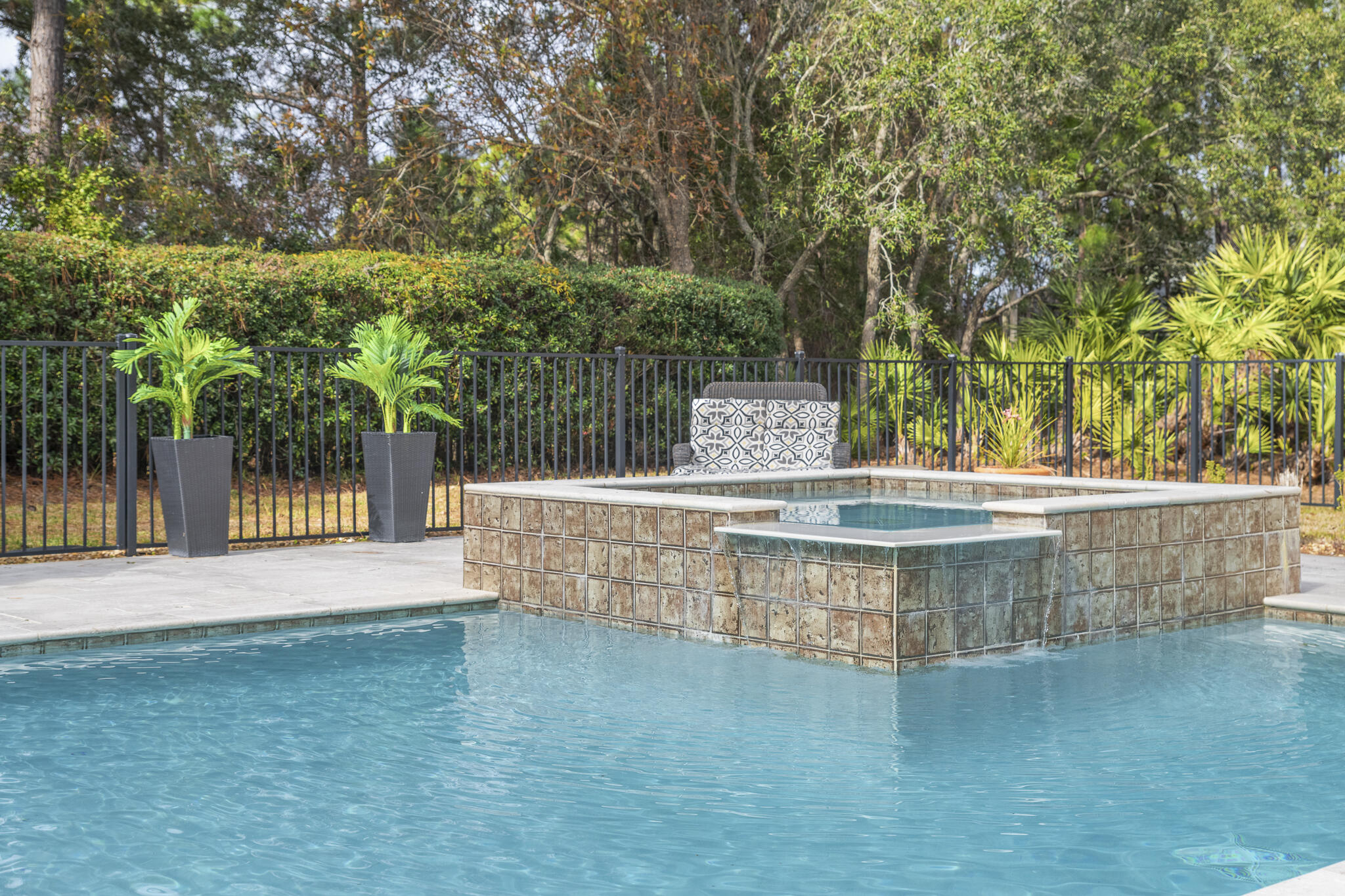PRIVATE OASIS retreat with massive Heated Pool/hot tub in the gated Golf Course Community of Emerald Bay. Lush greenery shields views from neighbors. Double, screened lanai w/ multiple fans. Master suite on 1st floor. Bonus family room/office w/ bright view of pool. Circular drive outside Grand Entryway greets guests. Priced to sell with an $18,000 closing cost credit to the buyer at closing.