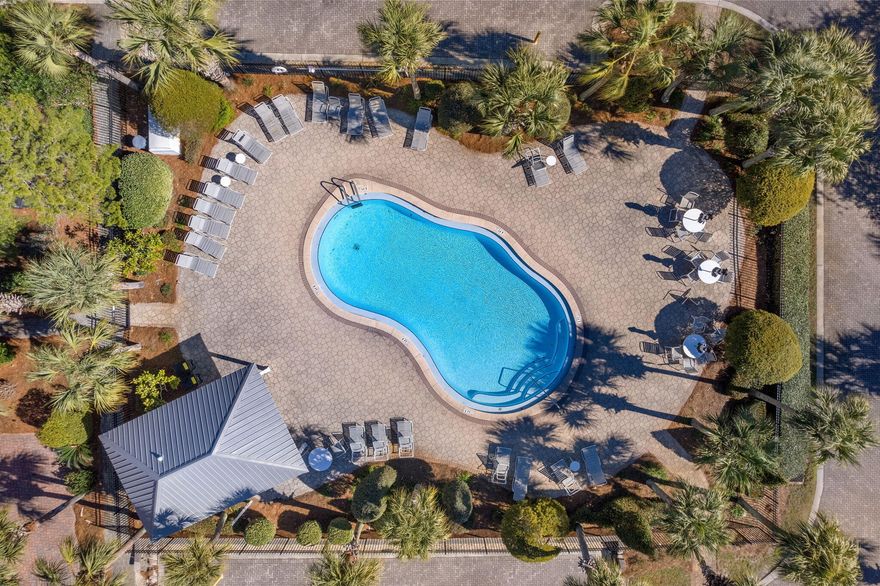 Charming 4BR/3BA Beach Cottage with Tower Room, Golf Cart Garage & Prime Location!
Located in the highly desirable community of Old Florida Village, this beautifully updated and furnished beach cottage offers the perfect blend of comfort, style, and rental potential. Just a short walk or bike ride to 3 public beach accesses, this home is a favorite among owners and guests alike.

Step inside to a light-filled open-concept living, dining, and kitchen area with granite countertops, new stainless appliances, upgraded lighting, and oversized tile flooring. The first-floor guest bedroom provides flexible space for visitors, while Brazilian Cherry hardwoods carry throughout the second and third floors, adding warmth and character. Upstairs, the spacious primary suite includes a private covered porch with serene views, and a generous en suite bathroom with dual vanities and walk-in shower. A charming 3rd floor tower room offers additional sleeping space with two trundle daybeds and tranquil lake viewsperfect for guests, reading, or a playroom.

Designer furnishings, plantation shutters, and hurricane impact windows add upscale touches throughout. Relax on one of several inviting porches or follow the brick paver path just steps to one of two neighborhood pools. The golf cart garage adds convenience and value, and the low HOA dues include landscaping for easy ownership.

Whether you're looking for a full-time residence, vacation getaway, or proven income-producing investment (strong rental history!), this home checks every box.