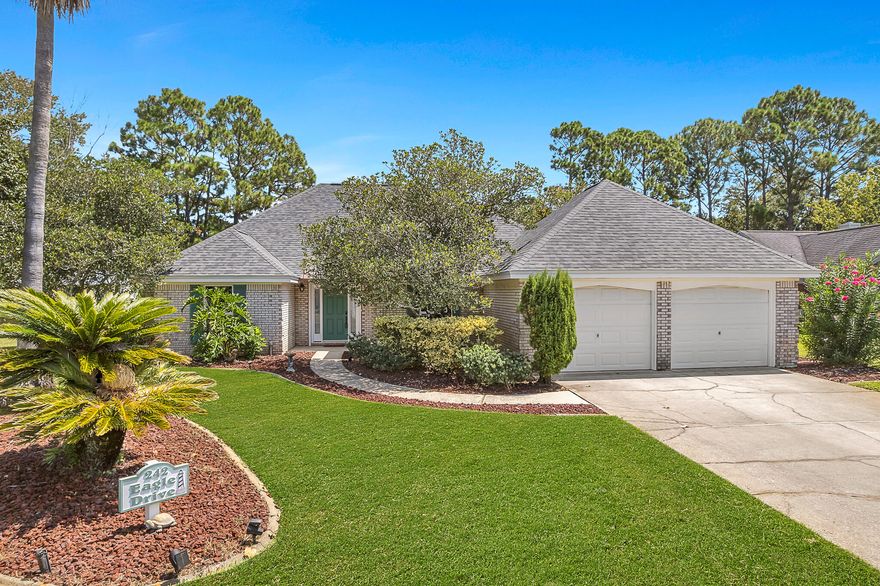 POOL. GOLF-COURSE VIEWS. QUIET LOOP STREET. ONE ADDRESS: 242 EAGLE DRIVE EAST. Brick pool home set beside the 18th hole of Legacy Golf Club, with the 8th fairway just beyonda"serene fairway vistas and easy indoor-outdoor living. A screen-enclosed, gunite chlorine pool and covered patio overlook the course, while beautiful landscaping adds curb appeal and privacy on both sides. Peace-of-mind features include impact-rated front windows, aluminum storm shutters (including a roll-down shutter at the entry), underground utilities, a sprinkler system on a private well, a UV-C light in the HVAC system for air/coil sanitation, and a new roof in 2024 with architectural shingles. Inside, a grand foyer opens to the central living room with fireplace, built-in entertainment center and window views to the backyard and the golf course. Interior finishes include Italian porcelain tile. Formal dining pairs with an eat-in breakfast area that frames the pool and fairway; the well-appointed kitchen features granite countertops, stainless appliances, and a breakfast bar. The primary suite offers a tray ceiling, tile flooring with inset carpet and private pool access, and its bath provides double vanities, a jetted tub, and a tiled walk-in shower. Bedroom 2 includes a walk-in closet with double doors and carpeted flooring; Bedroom 3 is tiled and showcases a custom, solid-wood, wall-to-wall deskideal for a home office. An oversized two-car garage accommodates a full-size truck, with one bay extra-deep at approximately 29' and overall width around 24'. Legacy Golf Club offers an 18-hole championship course plus a walkable, lighted 9-hole executive par-3 with first-come, first-served play. Nearby recreation includes Gayle's Trails, a paved multi-use network connecting parks and neighborhoods that's popular for biking, jogging, and easy strolls. You're also a short drive to Pier Park, the area's open-air shopping and dining district with plentiful restaurants, boutiques, the SkyWheel, and a movie theater. 

All information is deemed reliable but not guaranteed. Buyer to verify if important.
