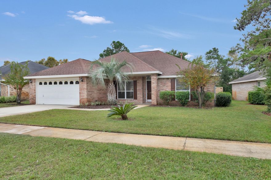 Back on the market!! Welcome to the beautiful Indian Lake community. Located conveniently on the backroads of Destin, this community is central to everything in Destin. As you drive up to your new home, you are welcomed with a beautifully landscaped yard and all brick exterior. As you walk in, you'll notice all new engineered hardwood floors throughout the house (no carpet). The vaulted ceilings are a welcoming feeling as you continue past your formal dining room immediately on the left. As you pass your living room fireplace, you'll enter your newly updated kitchen with granite counter tops, refurbished cabinets, stainless steel appliances, and all new fixtures. Venture out and to the right of the kitchen of your split bedroom home and enter the master bedroom...